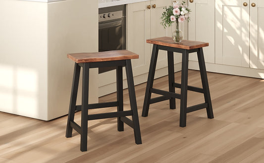Two brown wooden bar stools with black metal frames in a modern kitchen