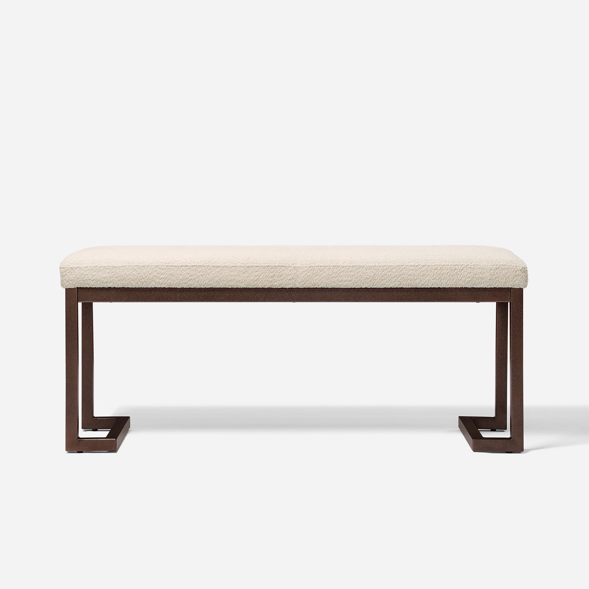 Cream boucle upholstered bench with dark bronze metal legs