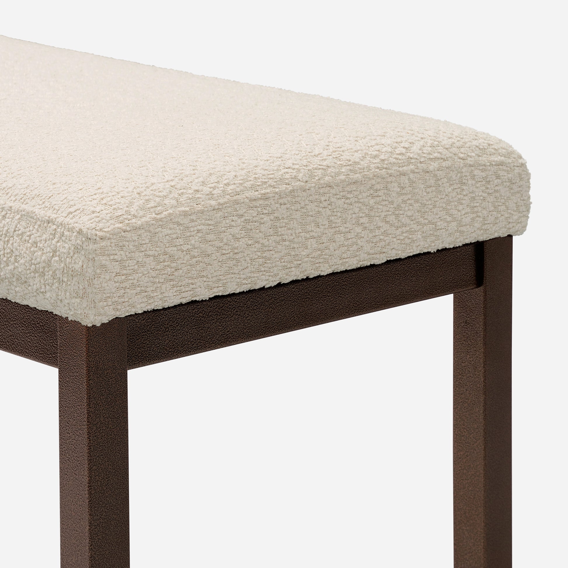 Cream textured upholstered bench with dark brown metal legs