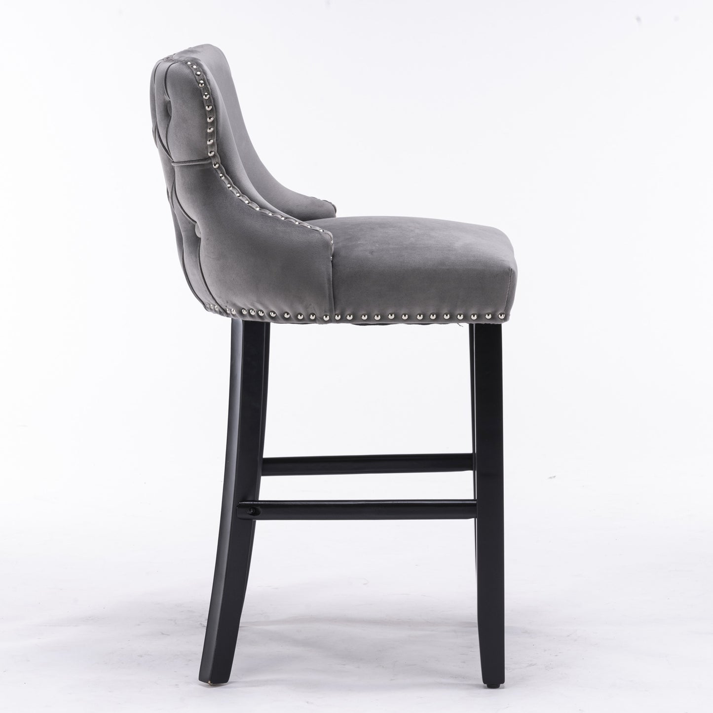 Grey velvet bar stool with tufted back and silver nailhead trim