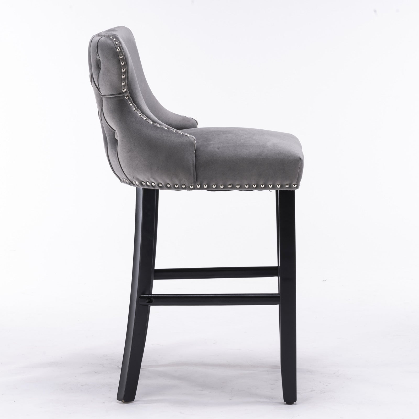 Grey velvet bar stool with tufted back and silver nailhead trim