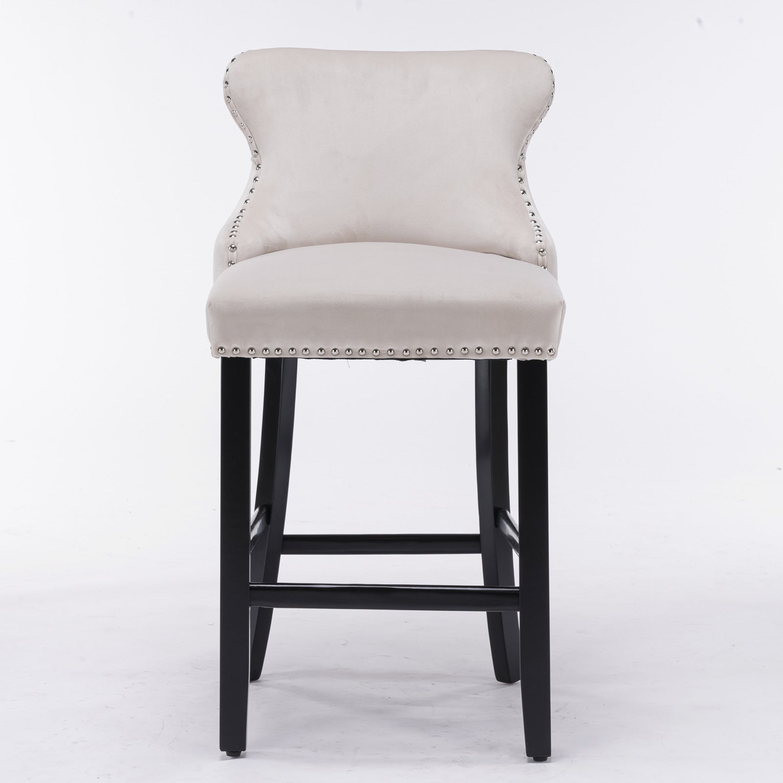 Tufted beige velvet bar stool with silver nailhead trim and black legs