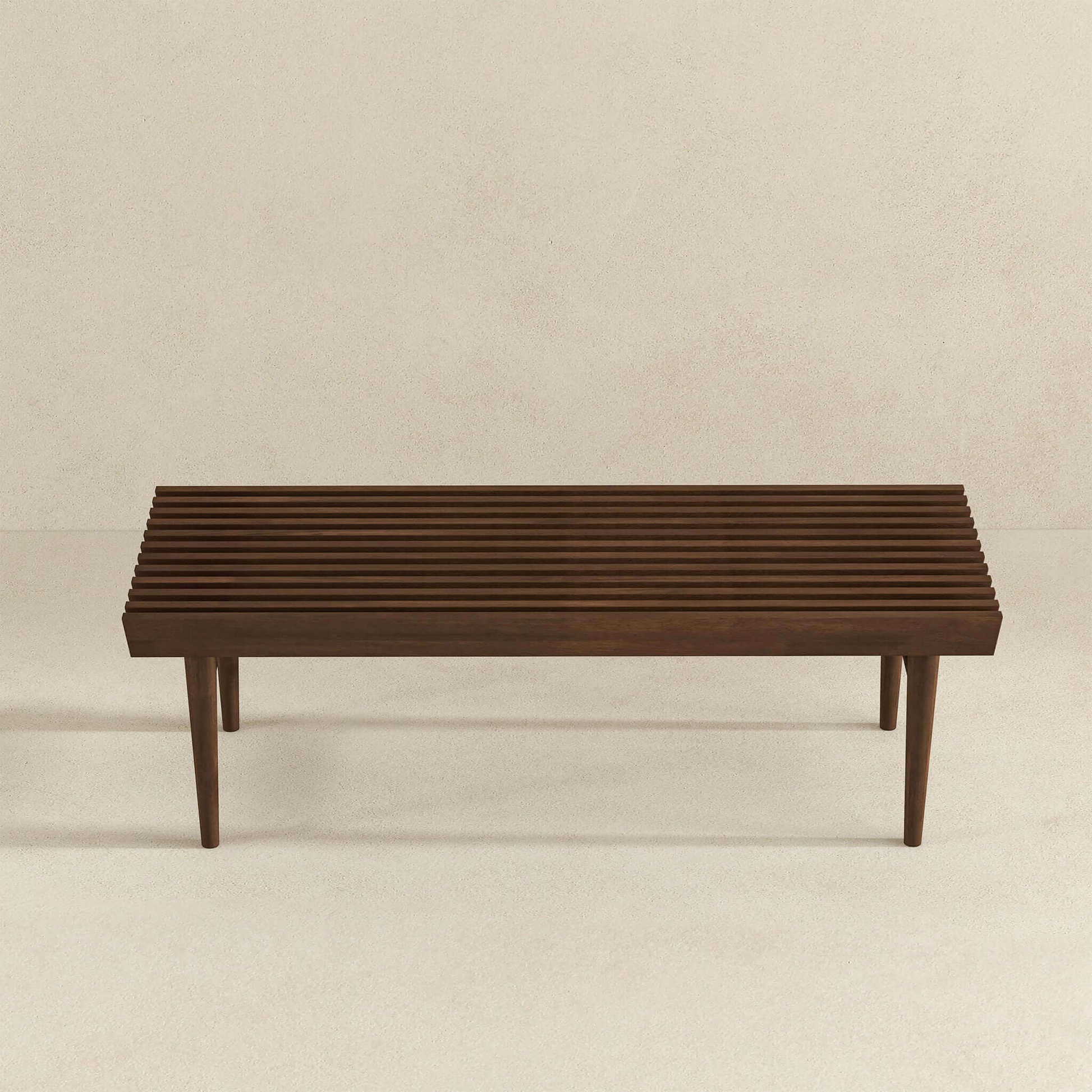 Dark brown slatted wooden bench with tapered legs