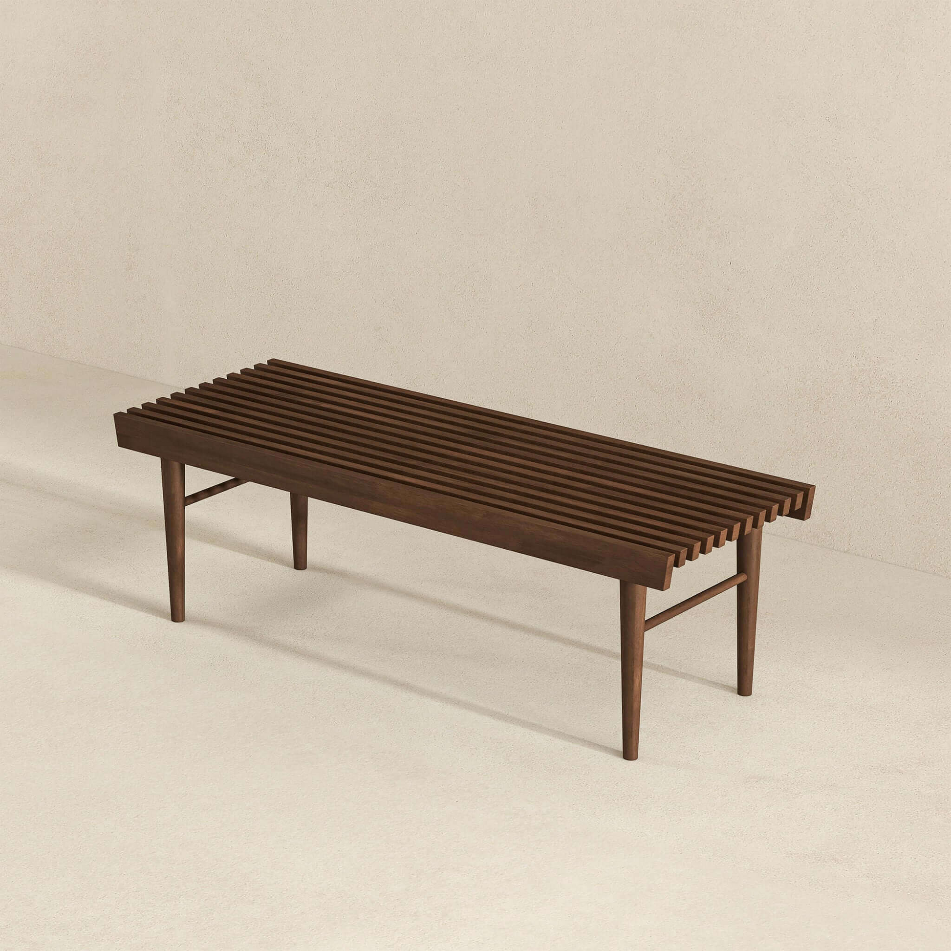 Dark wood slat bench with four tapered legs and midcentury modern design