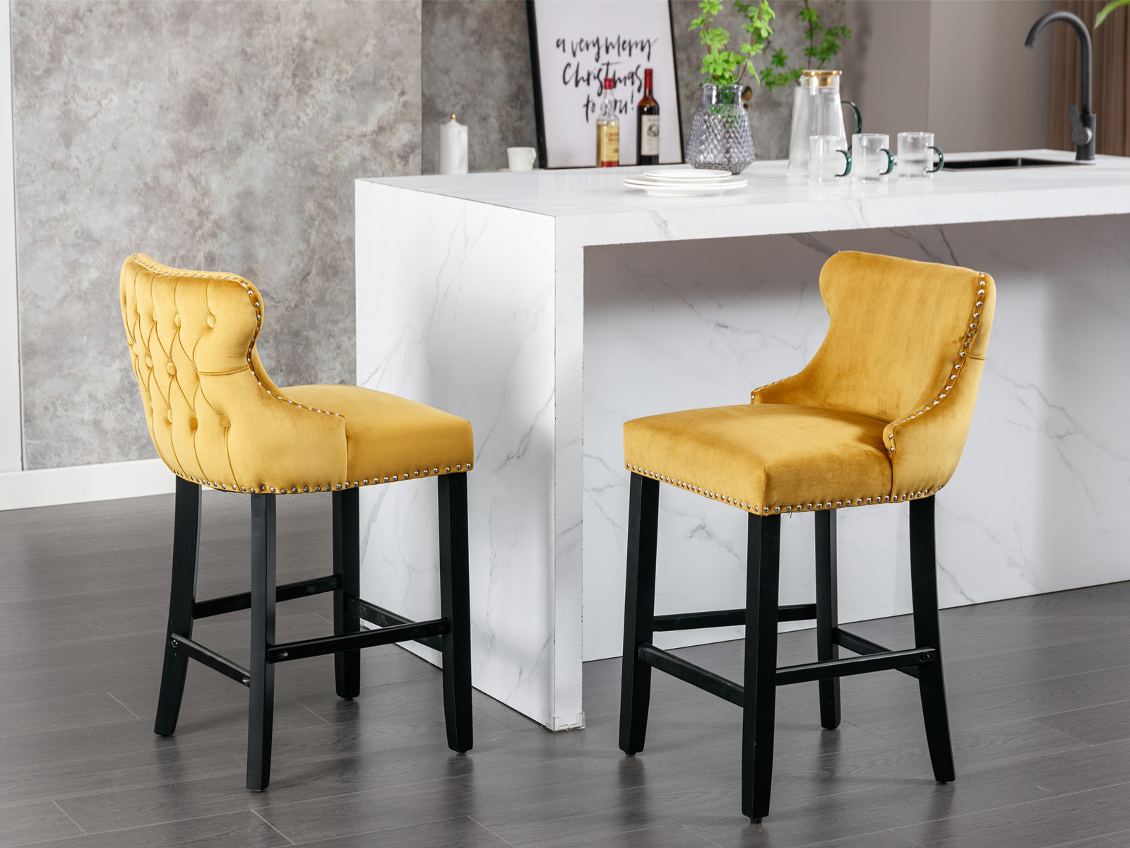 Yellow velvet tufted bar stool with silver nailhead trim and black wooden legs