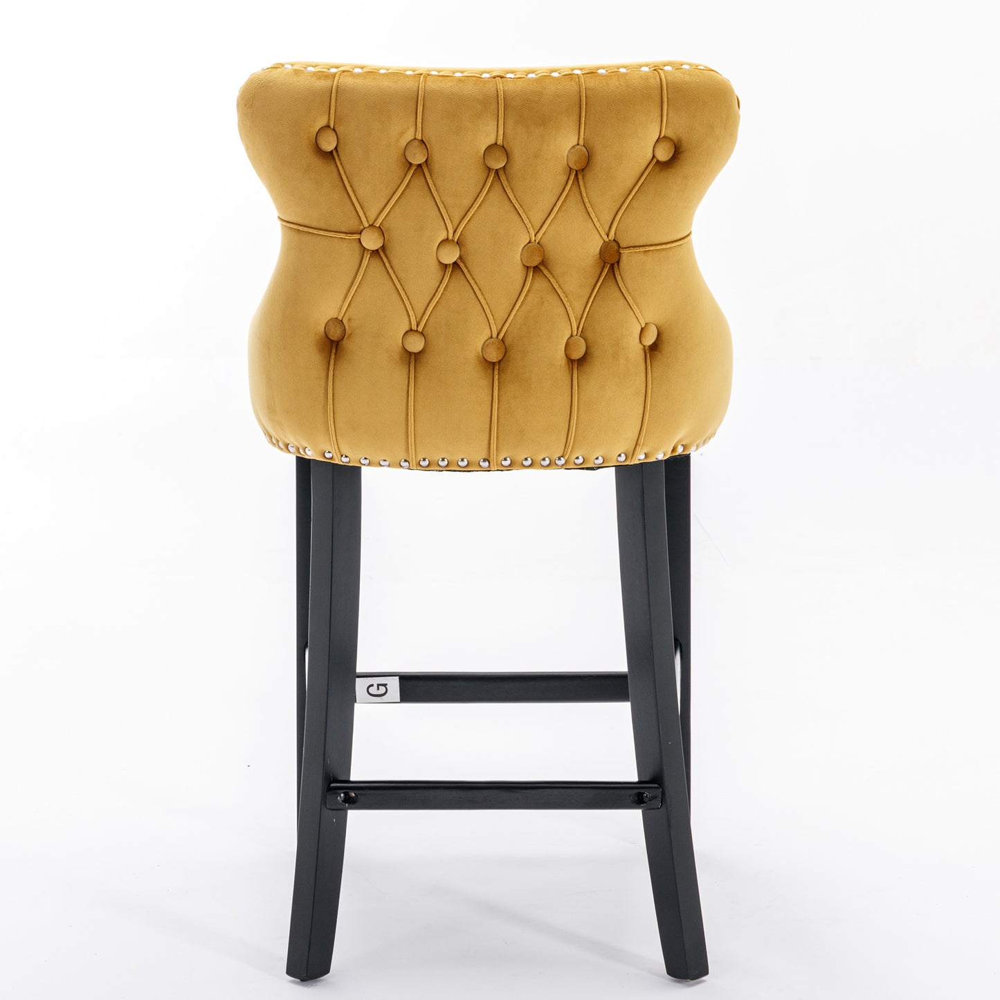 Golden velvet bar stool with diamond tufting and silver nailhead trim