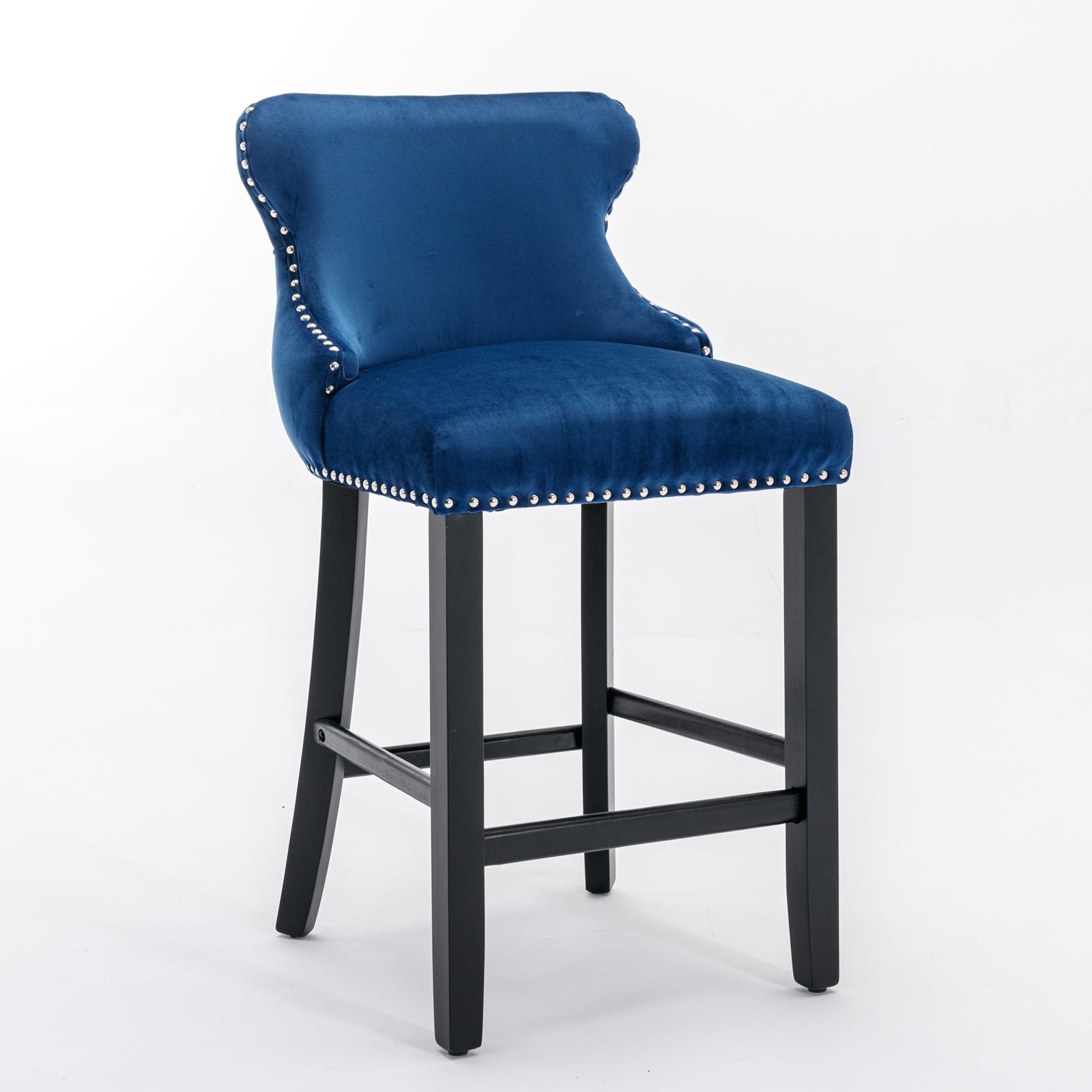 Deep blue velvet bar stool with silver nailhead trim and black wooden legs