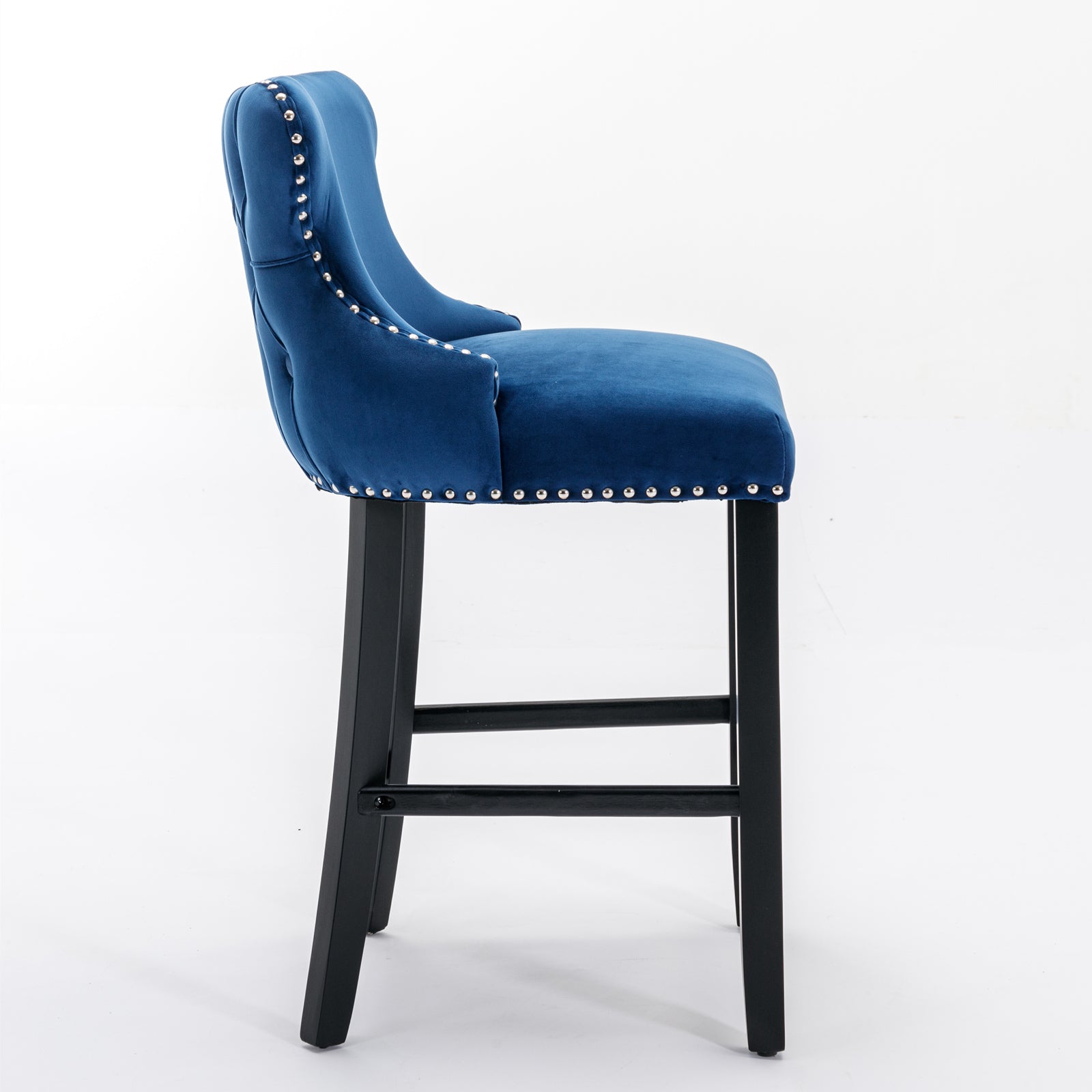 Tufted navy blue velvet bar stool with silver nailhead trim and black wooden legs