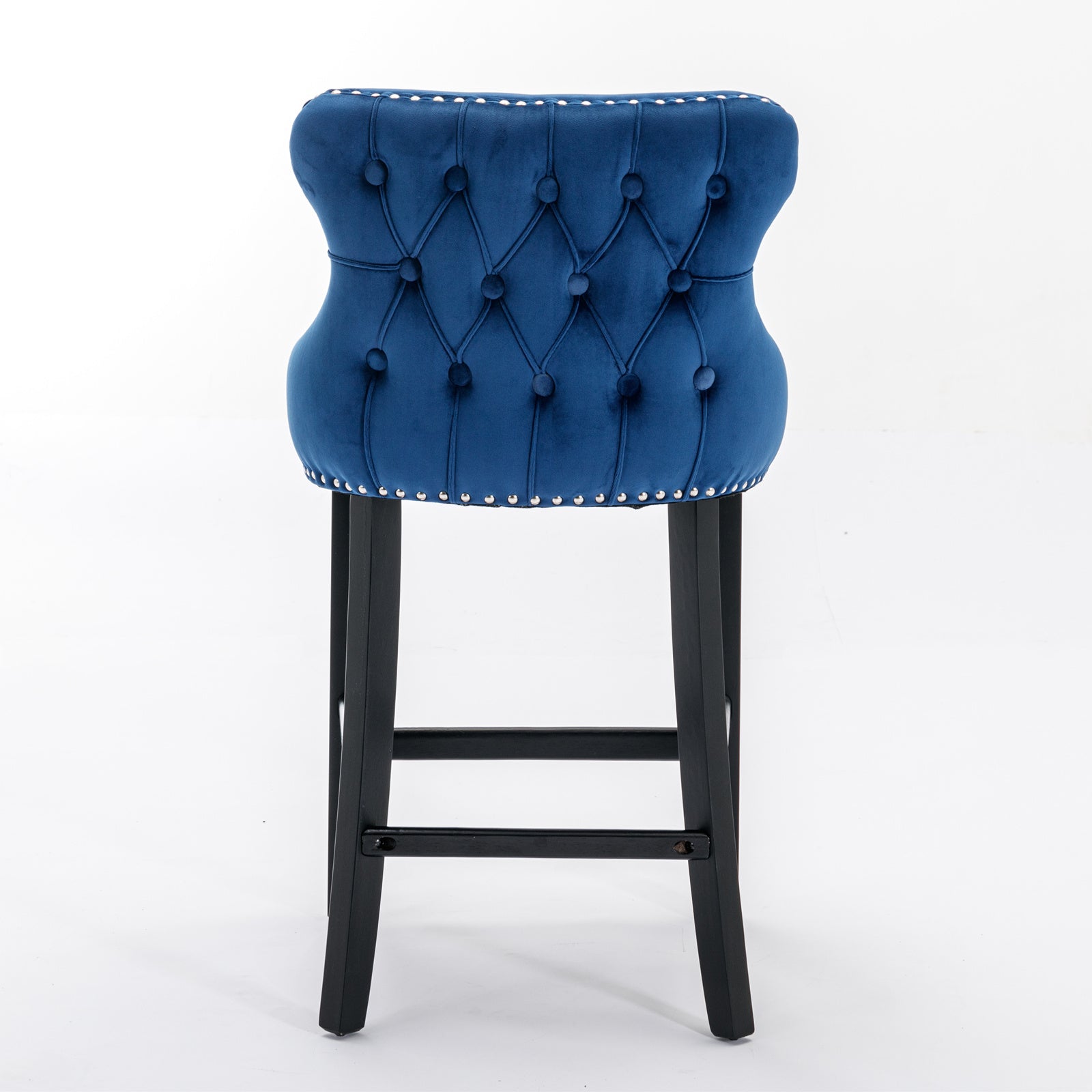 Deep blue velvet tufted bar stool with silver nailhead trim and black legs