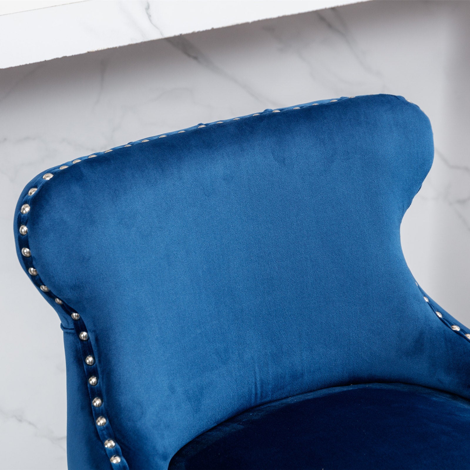 Royal blue velvet accent chair with silver nailhead trim