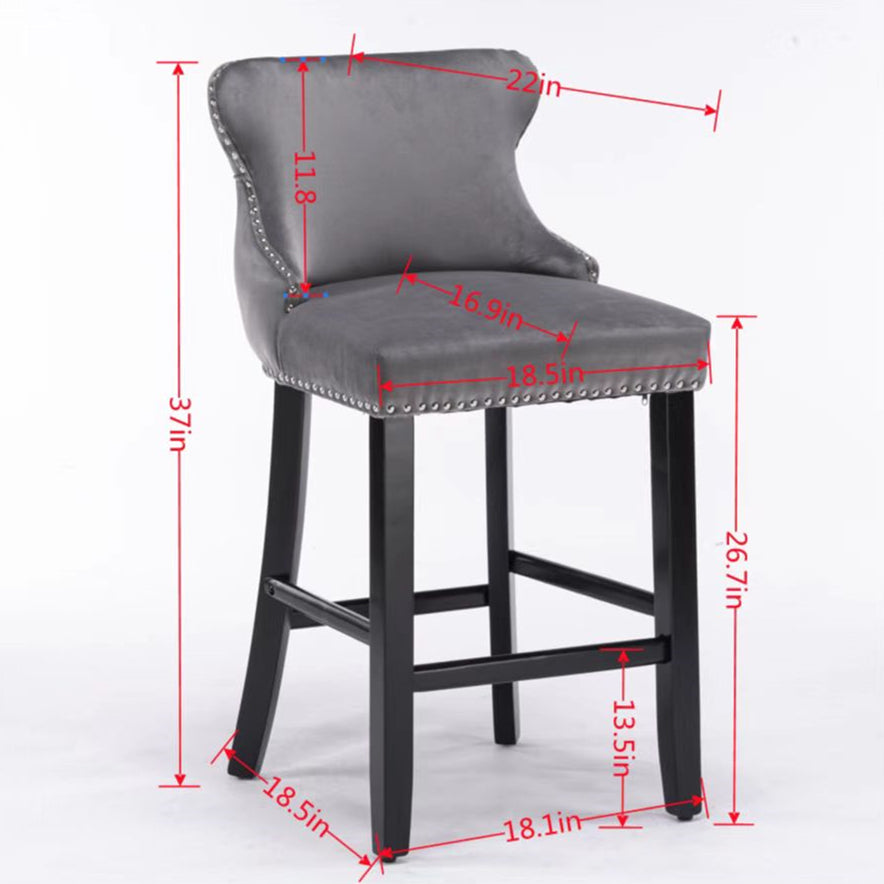 Gray velvet counter stool with silver nailhead trim and black wooden legs