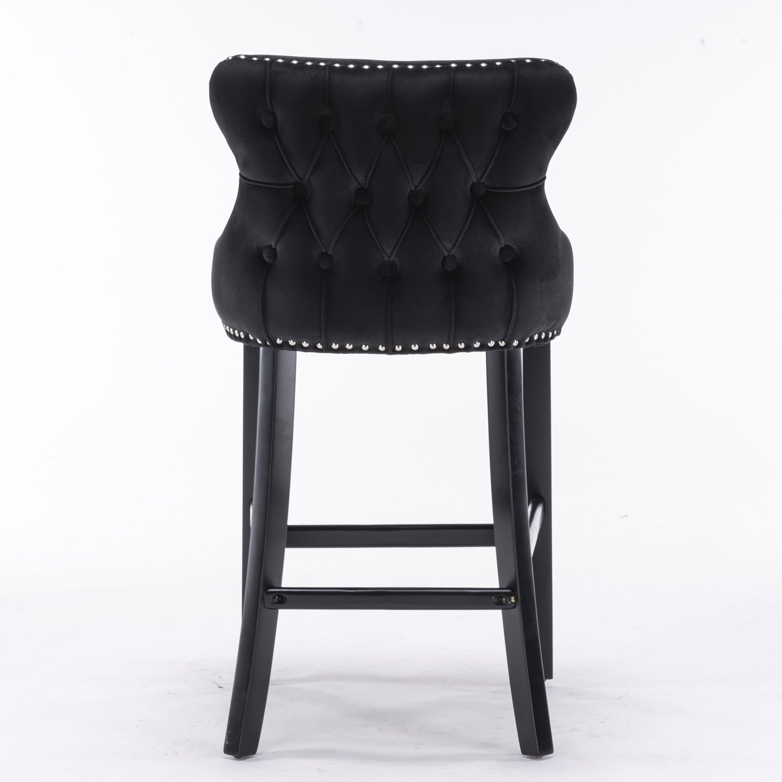 Black velvet bar stool with tufted back and silver nailhead trim