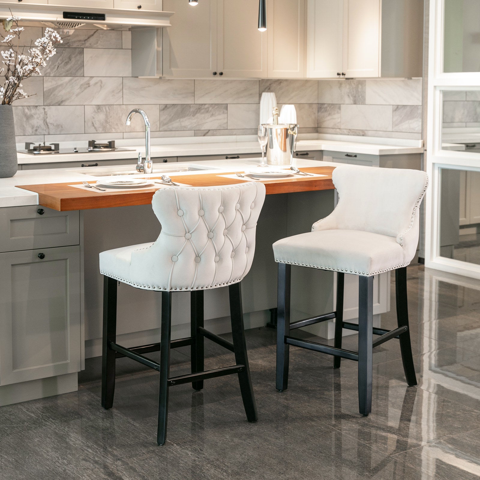 White upholstered tufted bar stool with silver nailhead trim
