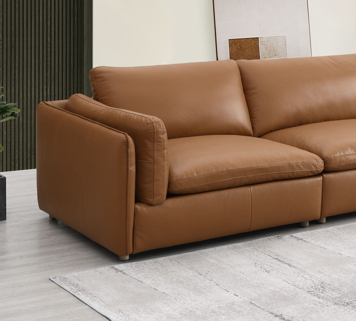 Luxurious caramel leather sectional sofa with plush cushions and clean stitching