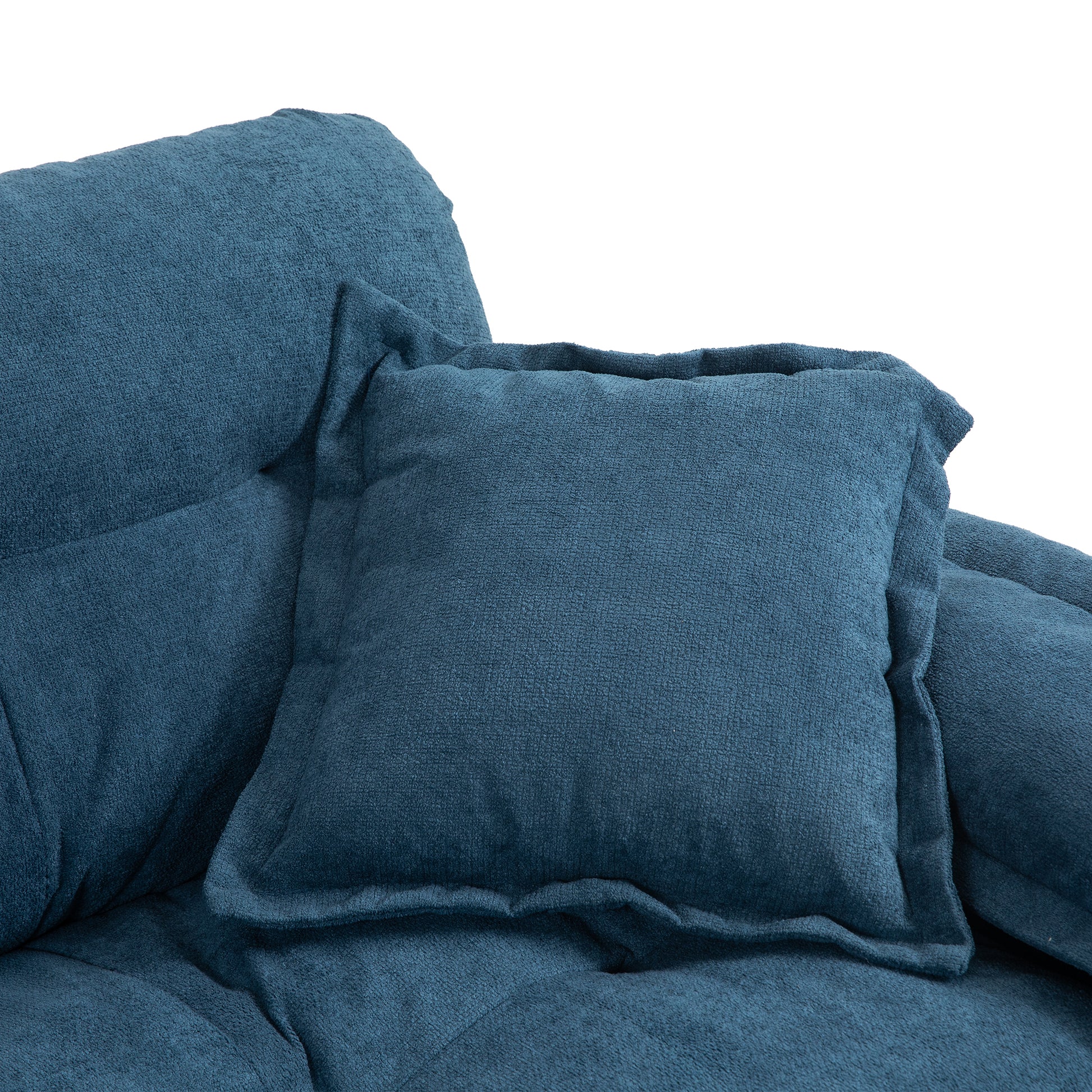 Deep blue textured fabric couch cushion detail plush and comfortable
