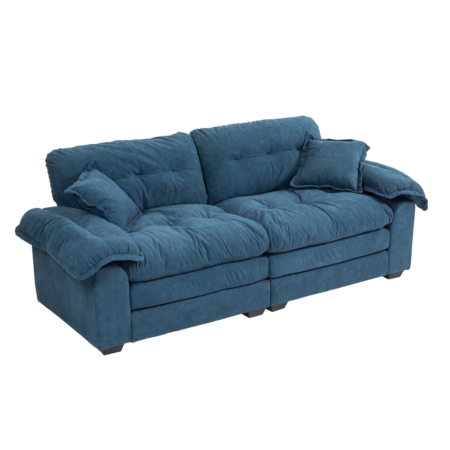 Plush blue fabric sectional sofa with deep tufted cushions and rolled arms for ultimate comfort