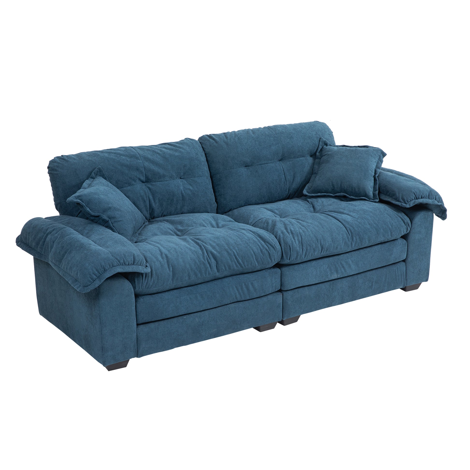 Plush blue fabric sectional sofa with deep tufted cushions and rolled arms for ultimate comfort