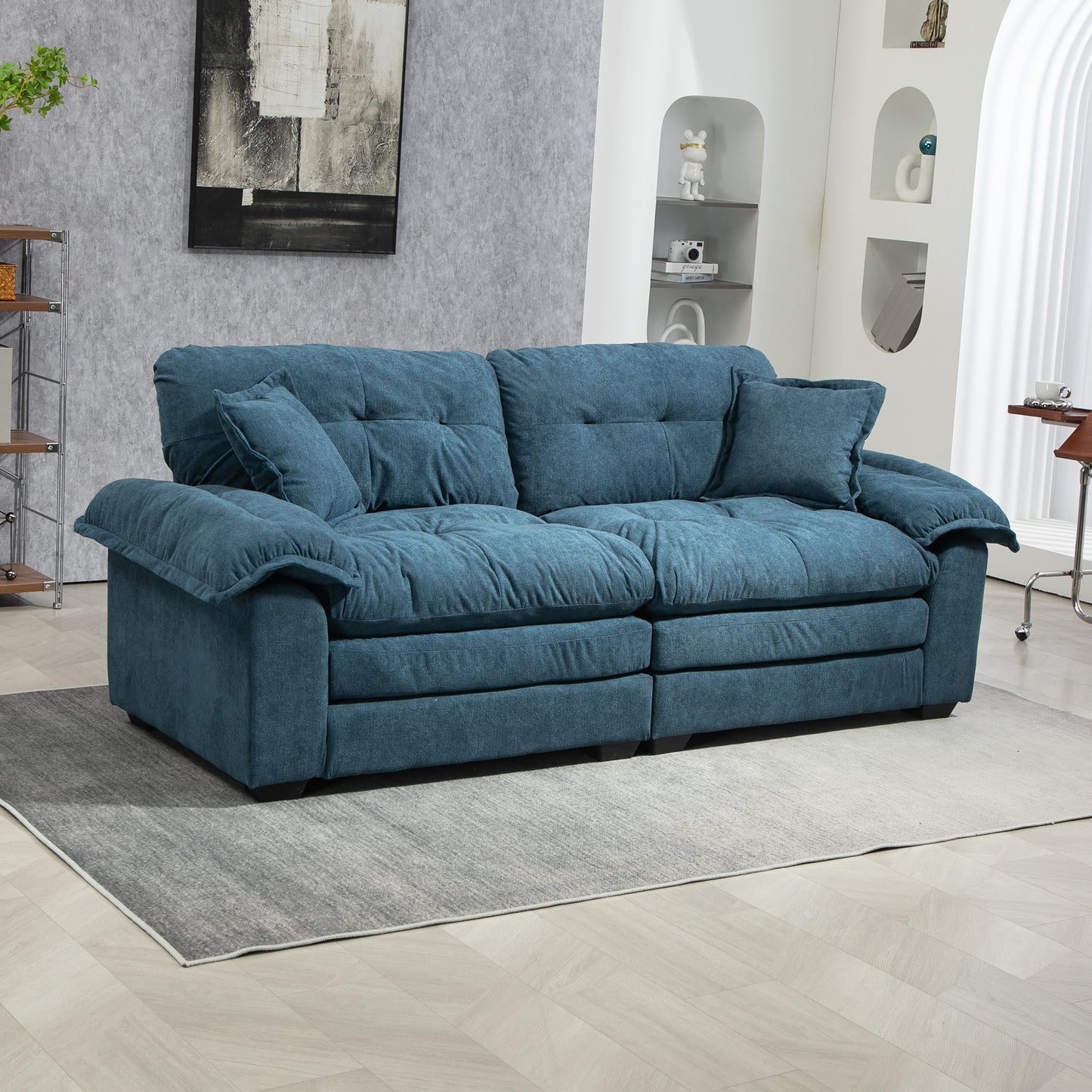 Deep teal fabric sofa with plush cushions and two throw pillows modern living room furniture