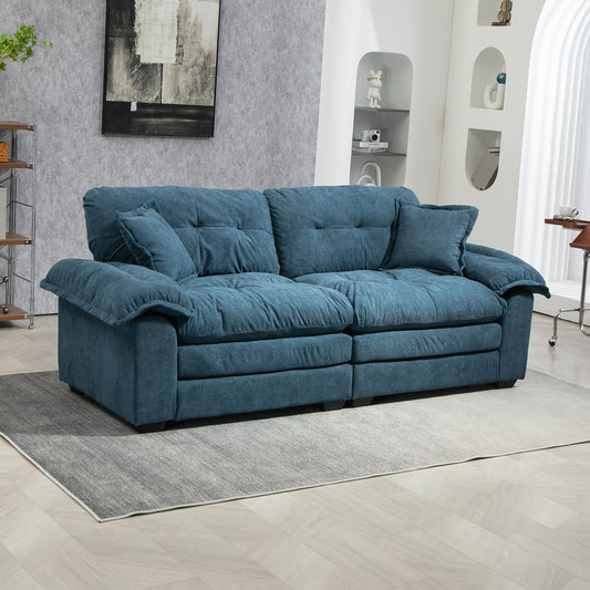 Deep teal fabric sofa with plush cushions and two throw pillows modern living room furniture