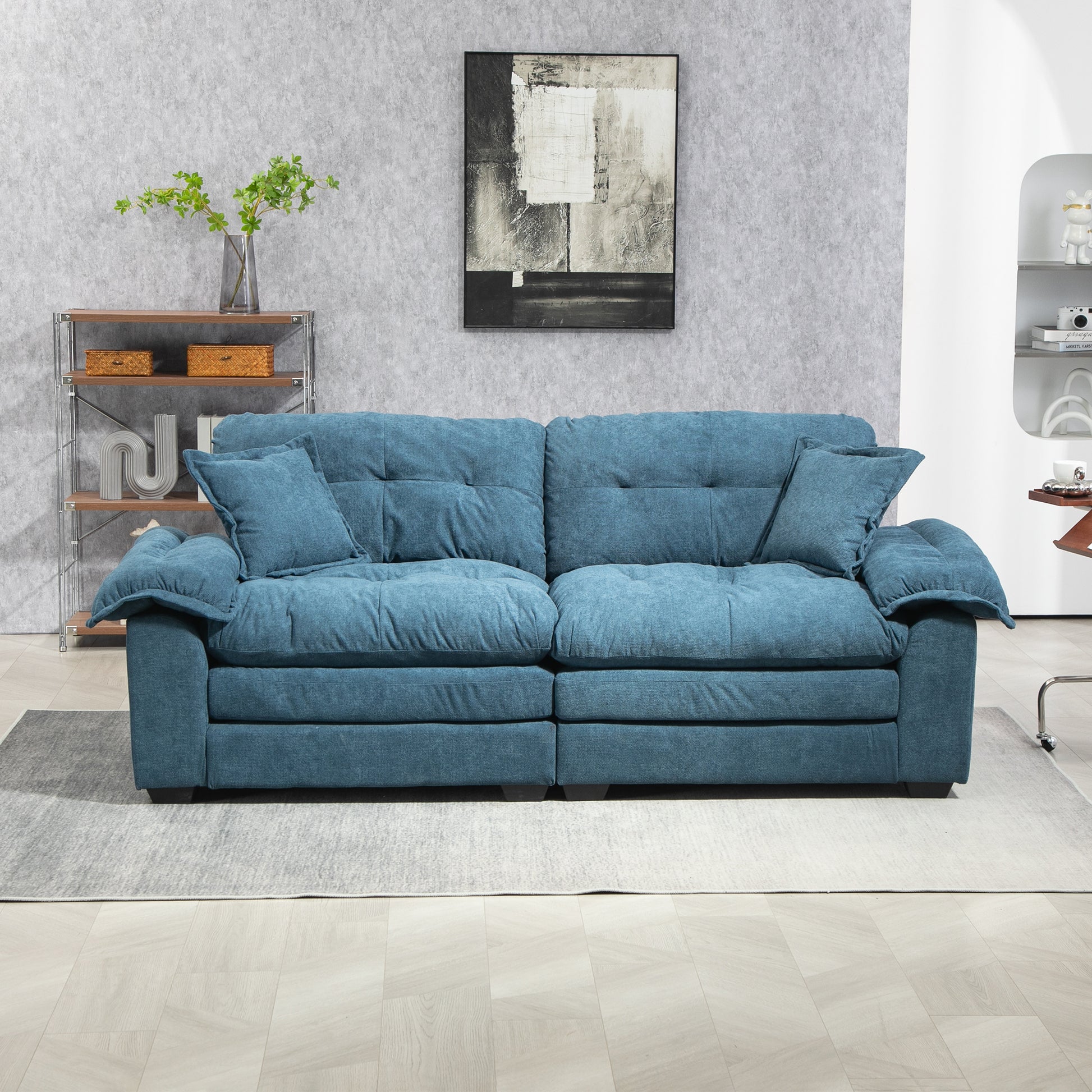 Plush teal chenille sofa with deep tufted cushions and plush armrests