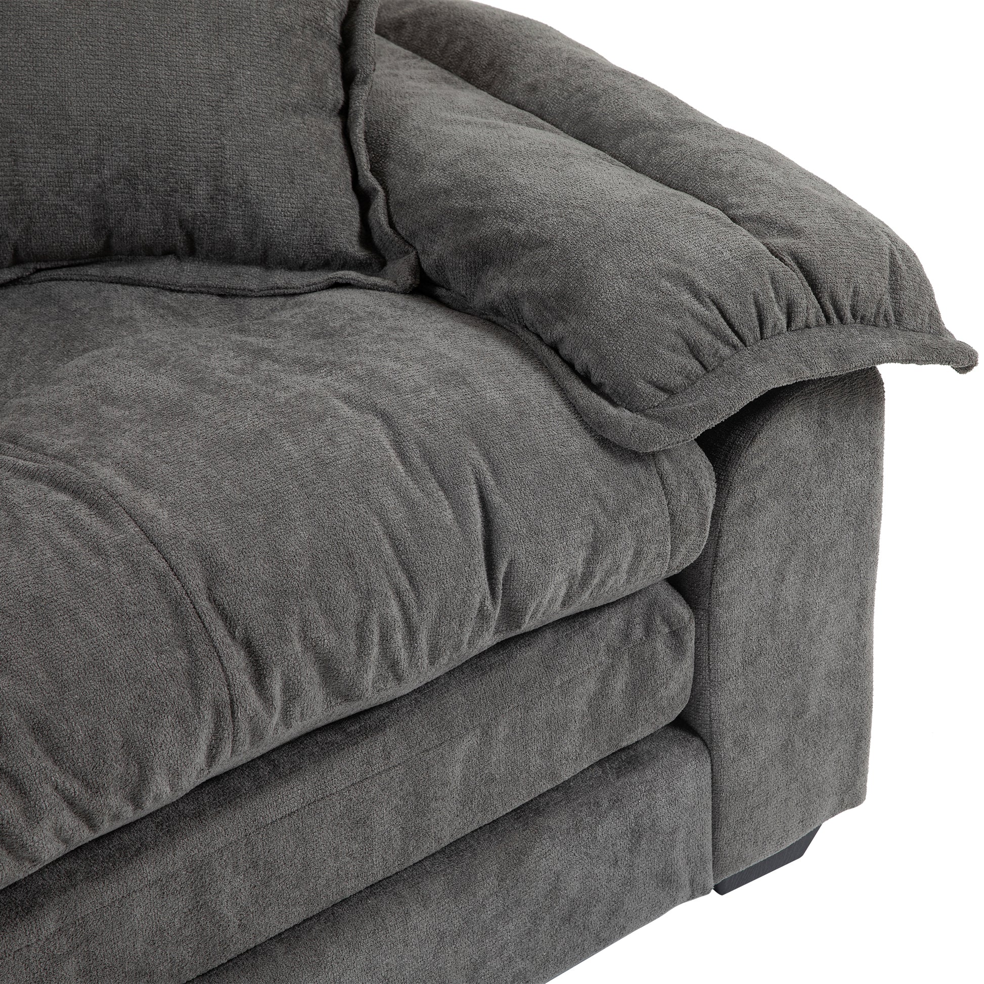 Plush charcoal grey fabric sofa armrest with textured cushions perfect for modern living rooms