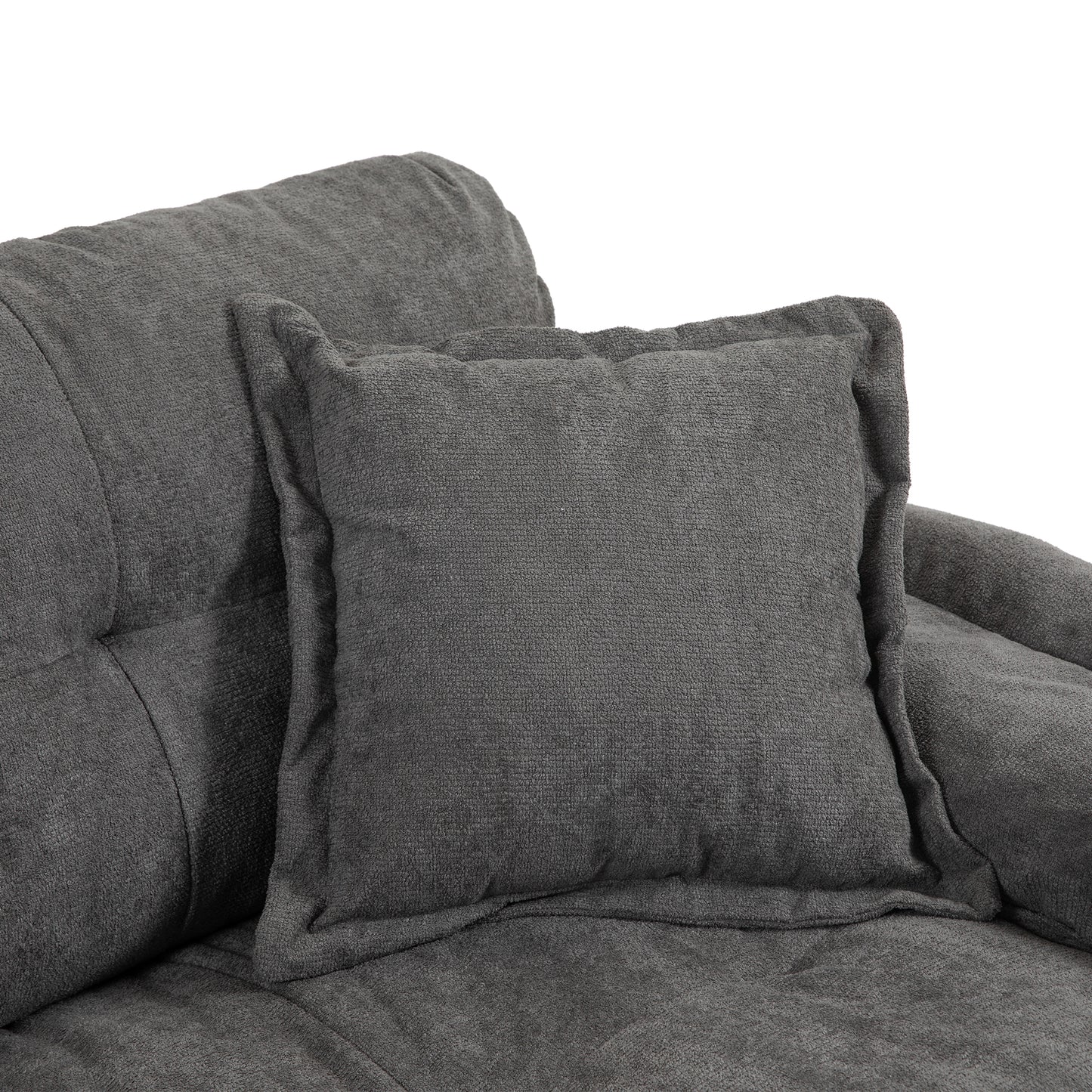 Close up of a charcoal grey textured throw pillow on a matching sofa