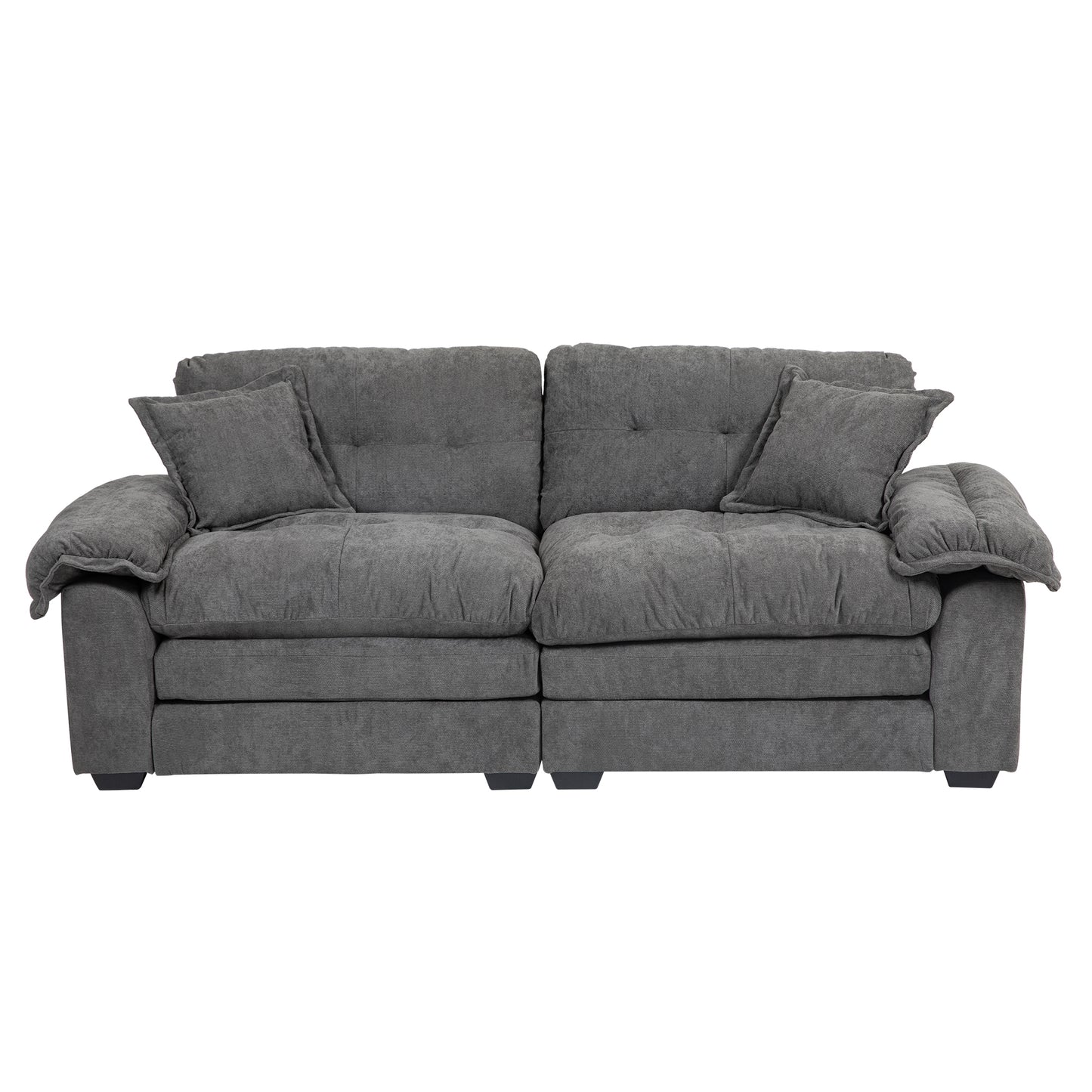 Charcoal grey plush fabric sofa with two accent pillows and tufted back cushions