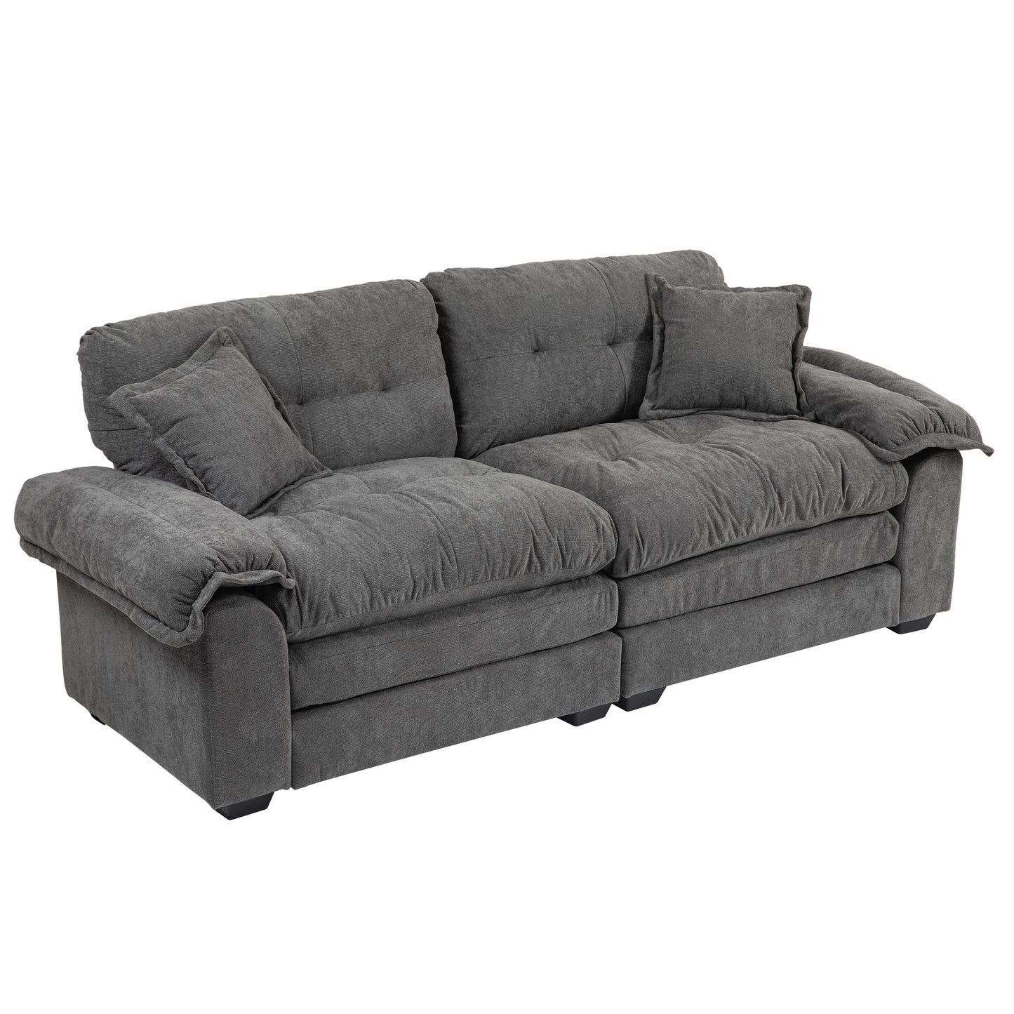 Plush charcoal gray fabric sofa with deep tufted cushions and rolled arms perfect for a cozy living room