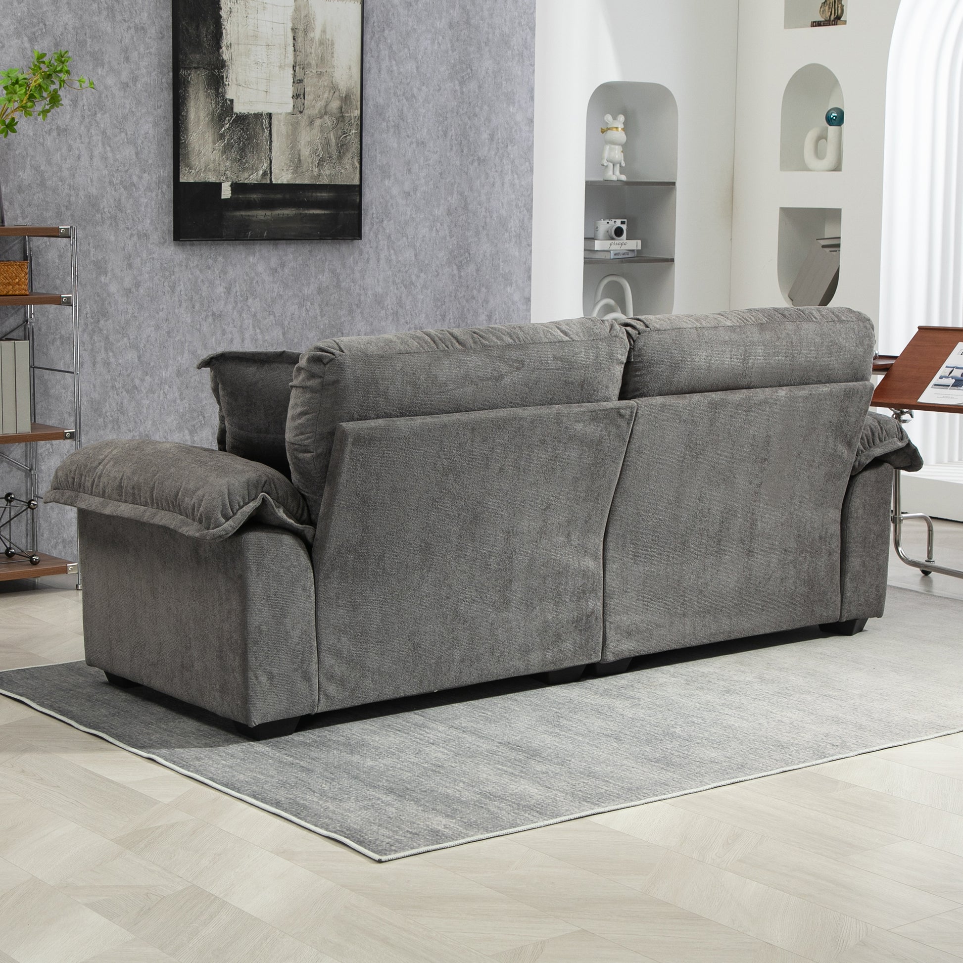 Gray fabric threeseater sofa with plush cushions perfect for a modern living room