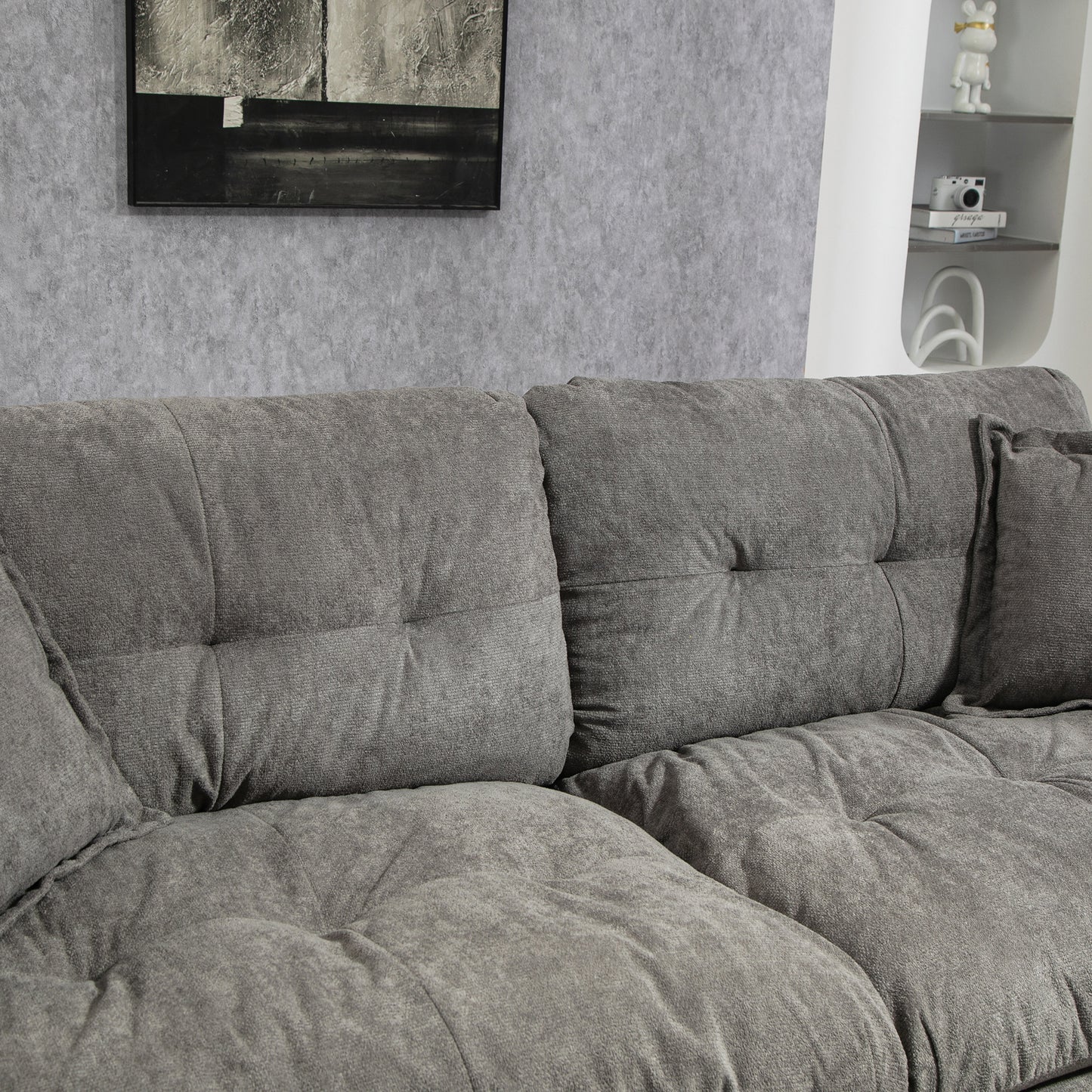 Plush grey fabric sectional sofa with deep tufted cushions for ultimate comfort