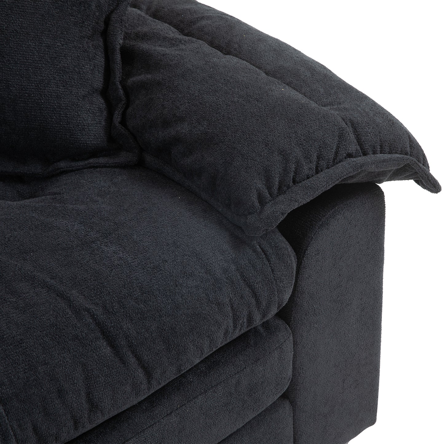 Plush black fabric armchair with deep cushioning ideal for a cozy living room
