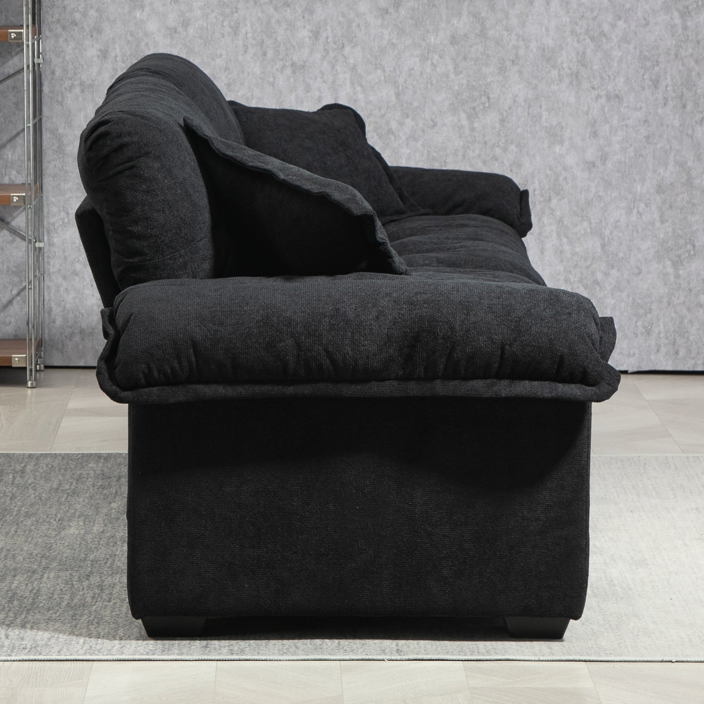 Dark charcoal fabric sofa with plush cushions perfect for modern living rooms