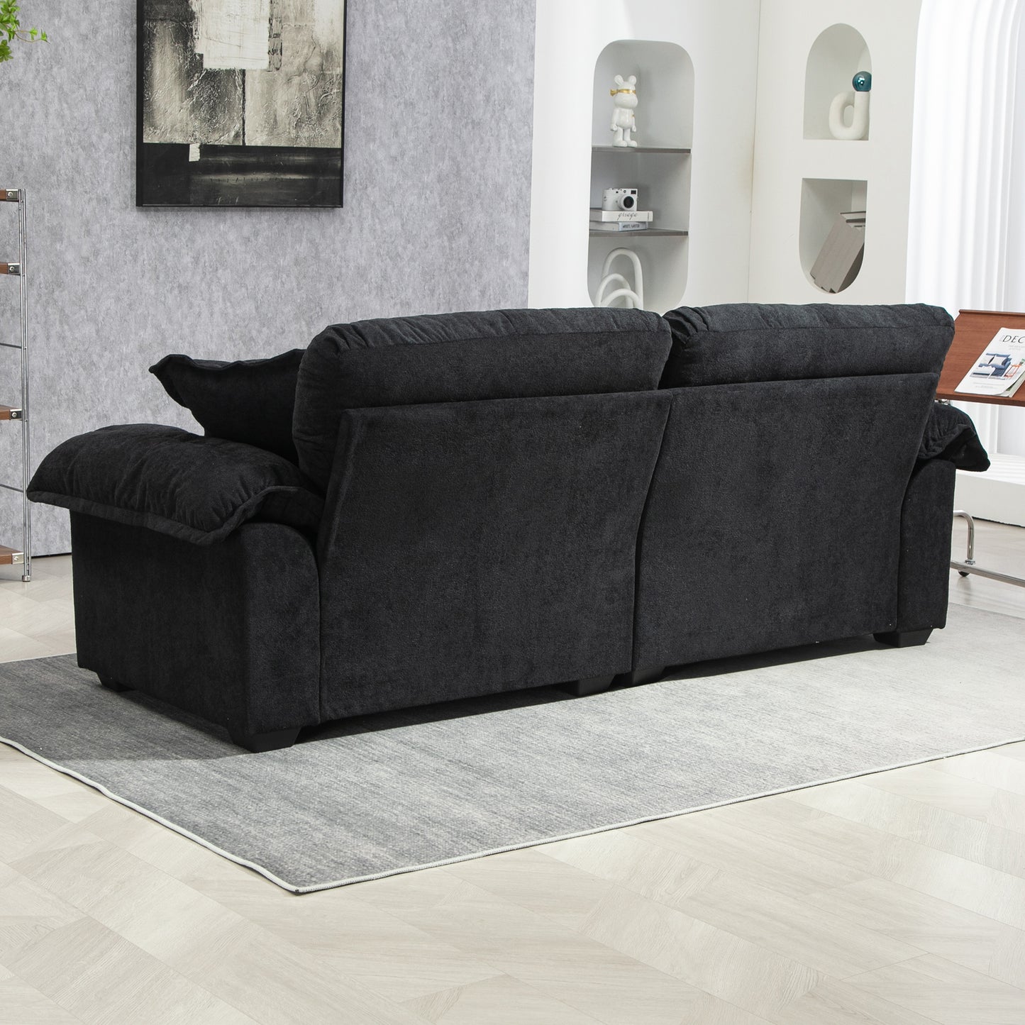 Deep charcoal textured fabric sofa with plush cushions designed for modern living rooms