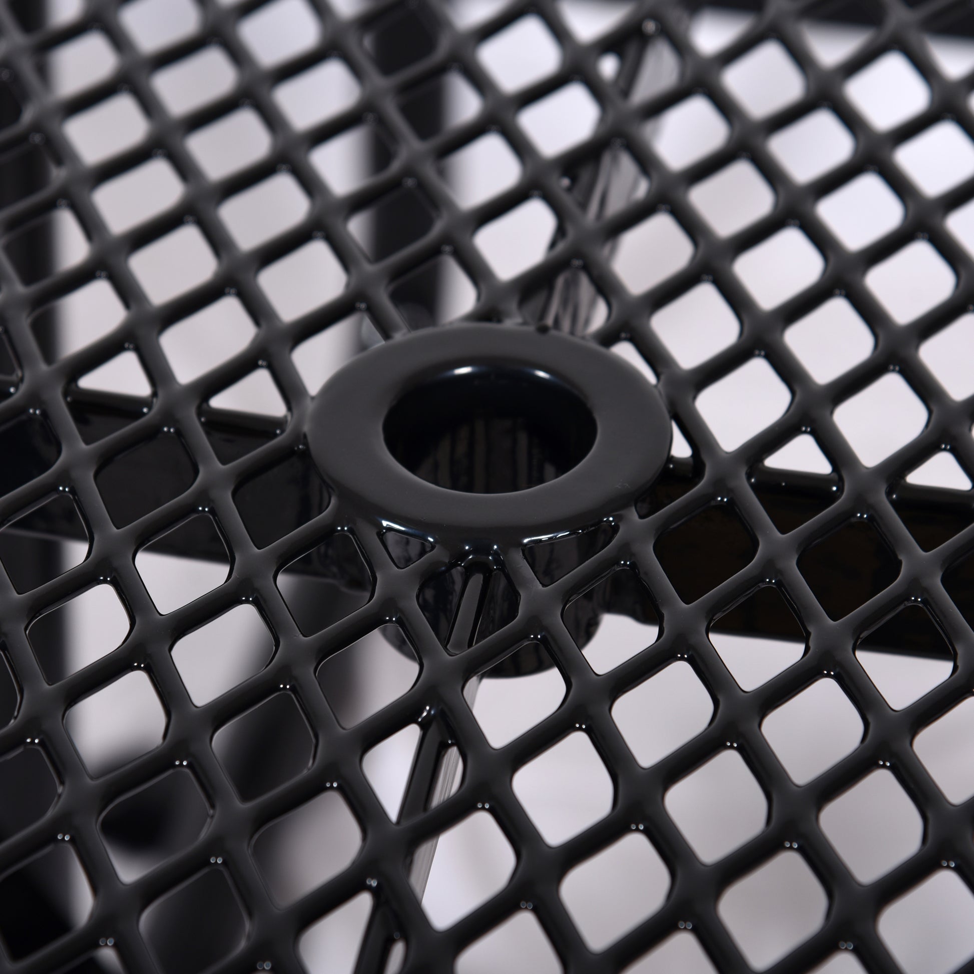 Black diamond mesh table top detail with umbrella hole for outdoor patio furniture
