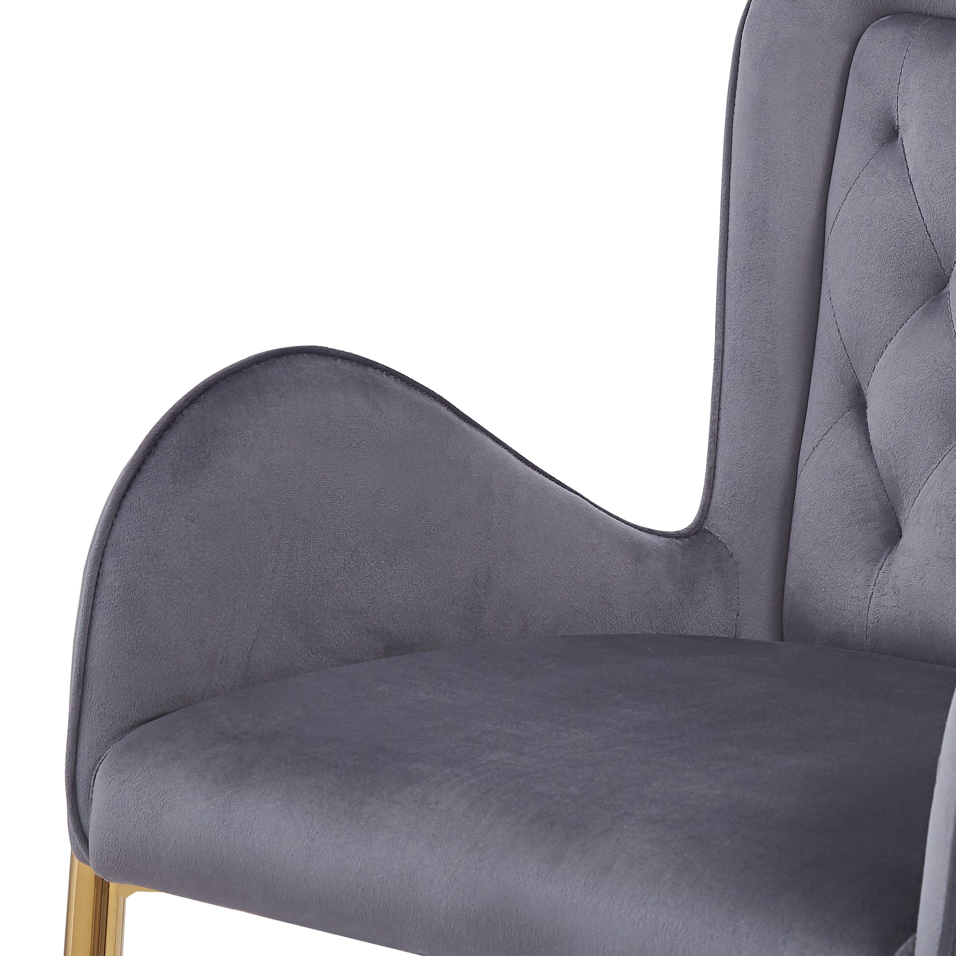 Grey velvet accent chair with tufted back and gold legs