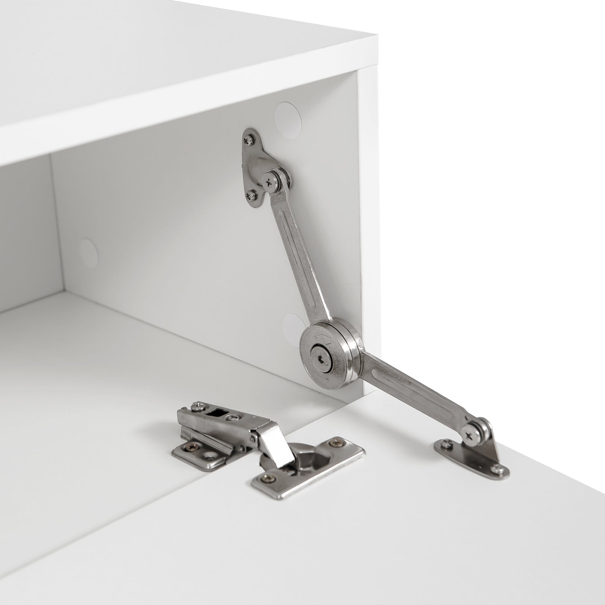 Closeup of white cabinet door hinge mechanism and screws for furniture assembly