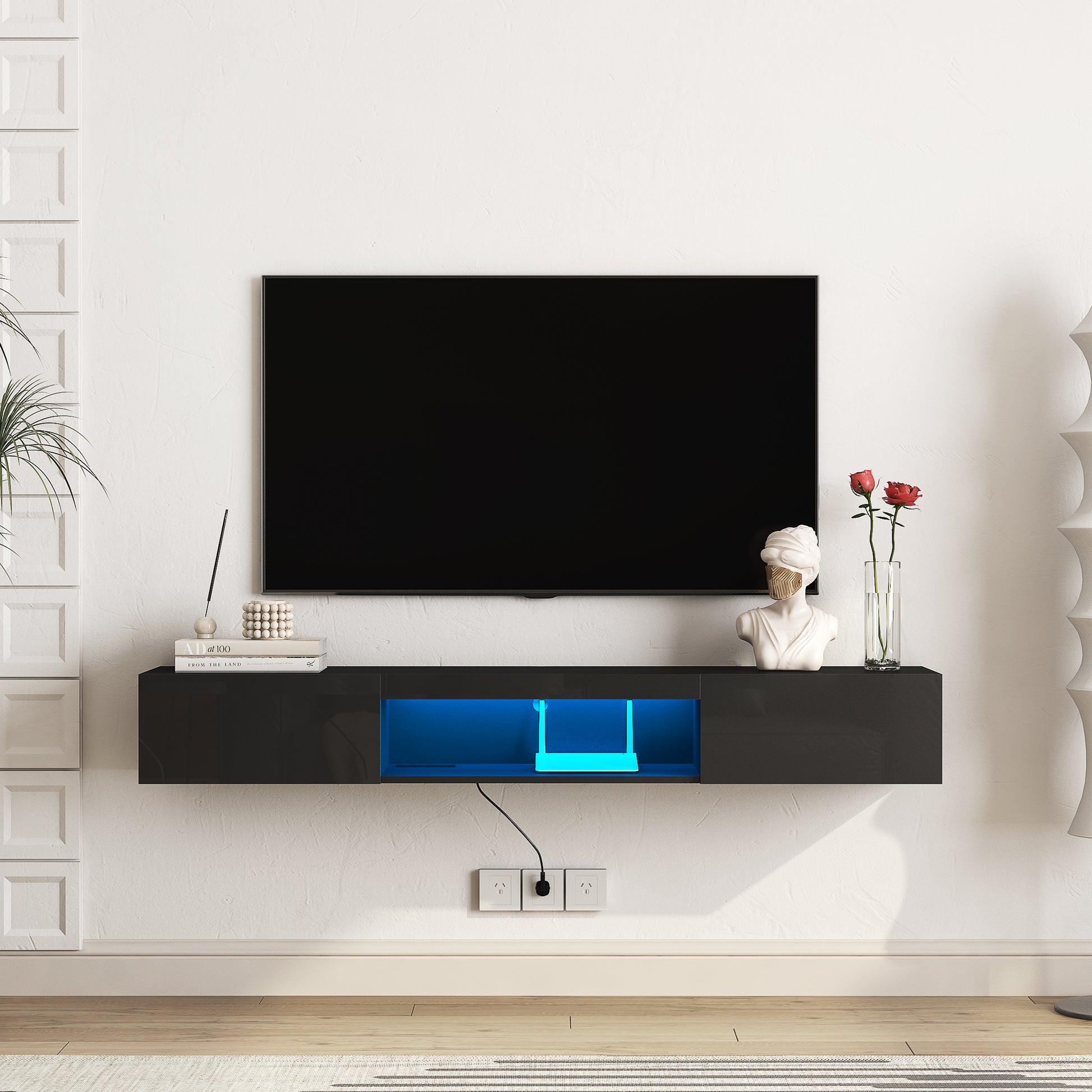 Sleek black floating TV stand with blue LED lighting ideal for modern living rooms