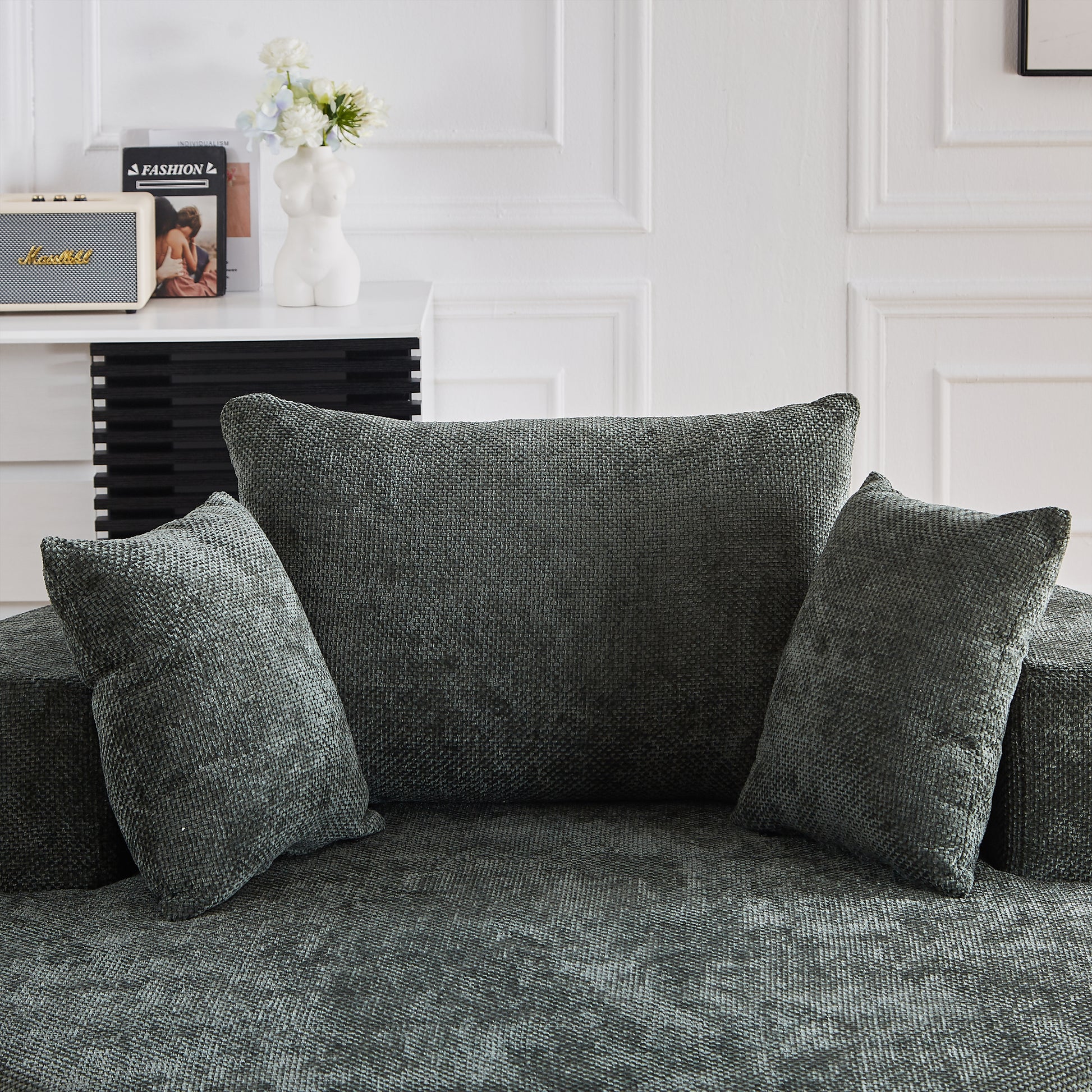 Dark grey woven textured sofa with accent pillows