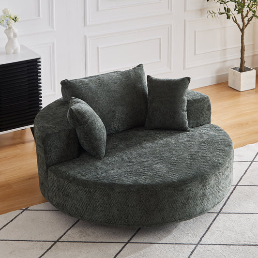 Plush round accent chair in dark teal textured fabric with matching throw pillows for cozy seating