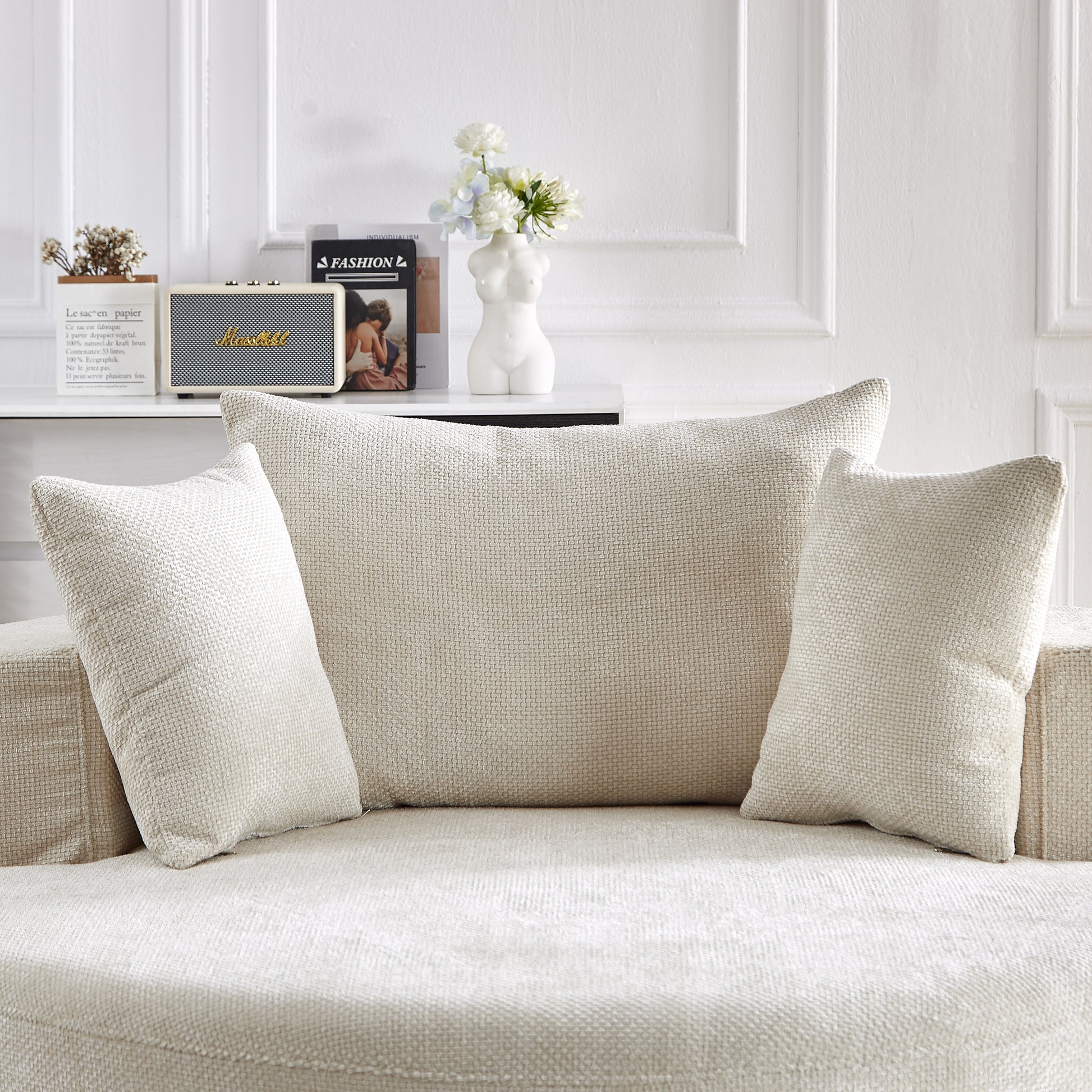 Cream textured throw pillow with subtle woven pattern perfect for adding comfort