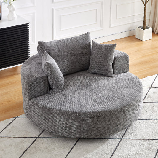 Plush gray swivel chair with textured fabric and matching accent pillows perfect for a cozy living room