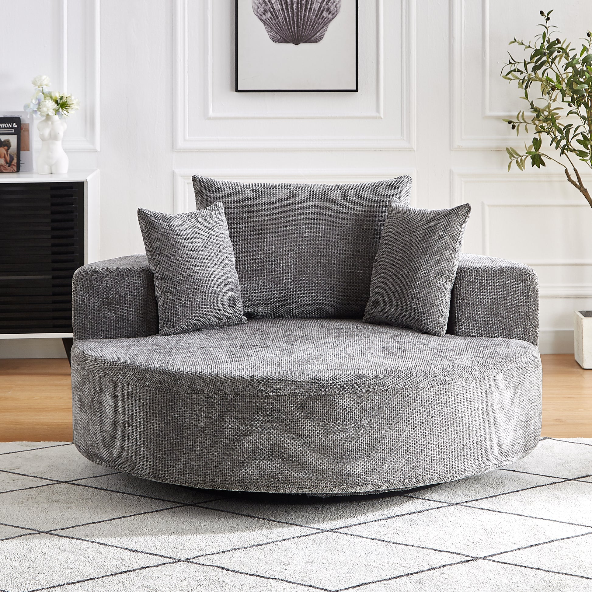 Plush grey swivel barrel chair with textured fabric upholstery and plush cushions for ultimate comfort