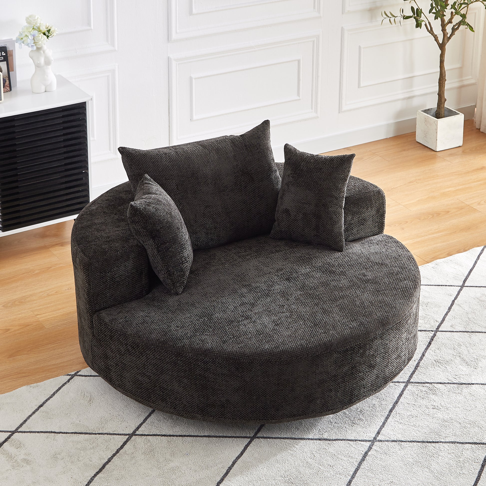 Cozy dark grey fabric circular accent chair with plush cushions perfect for modern living rooms