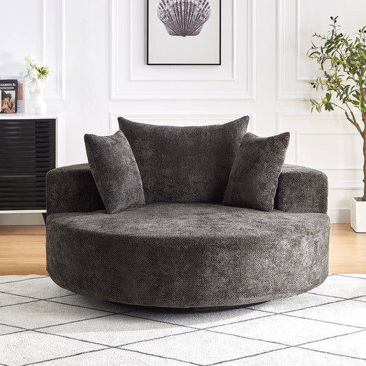 Dark grey circular swivel accent chair with textured fabric and plush cushions