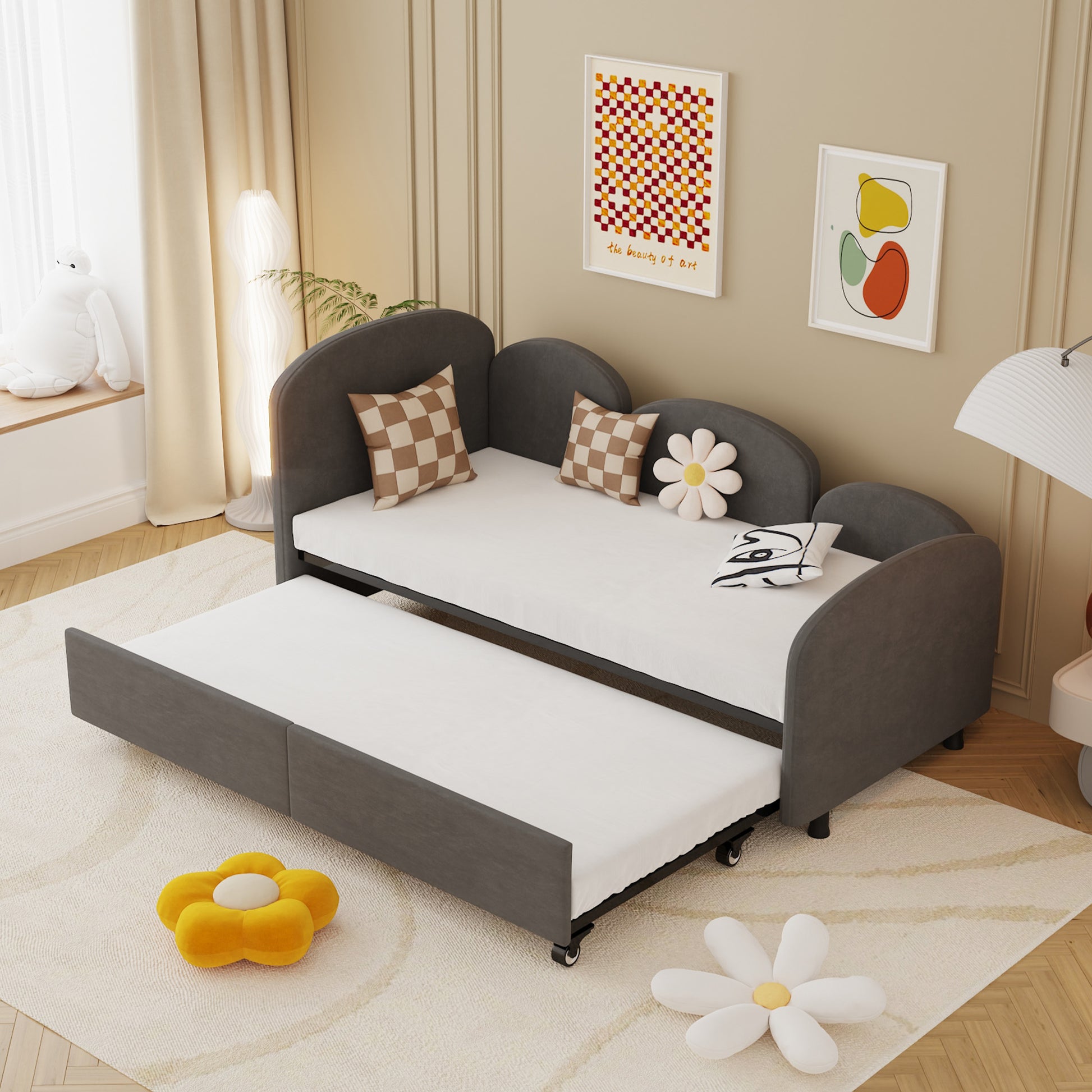Dark gray upholstered daybed with pullout trundle perfect for kids rooms