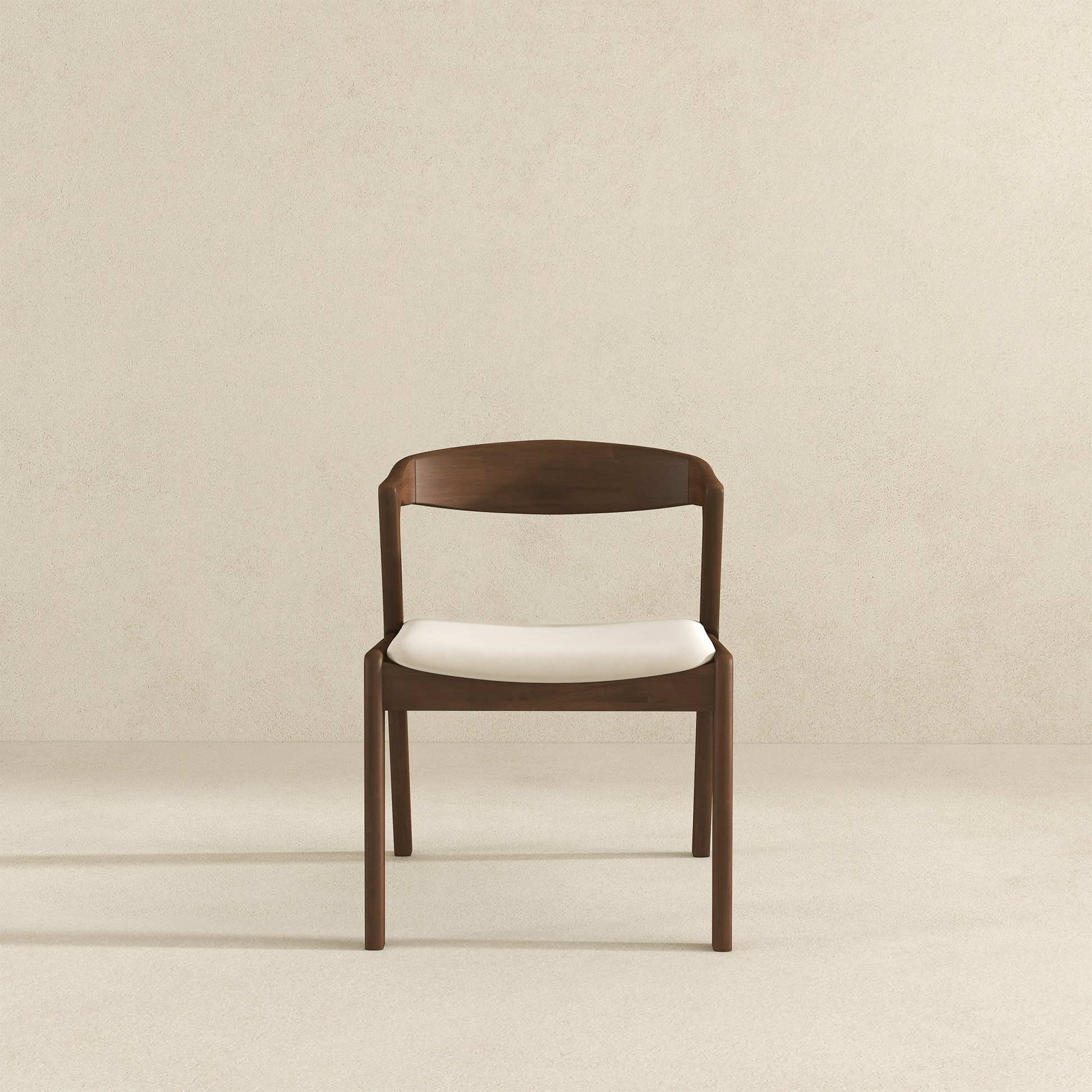 Modern dark wood dining chair with a natural white upholstered seat for versatile home decor
