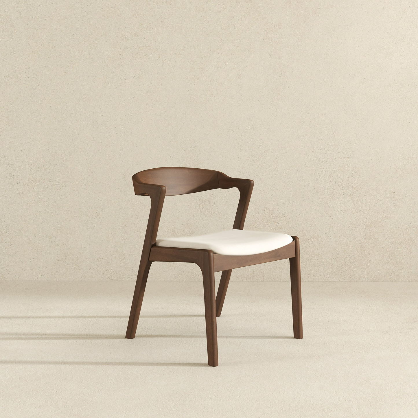 Modern wooden dining chair with white upholstered seat and curved back