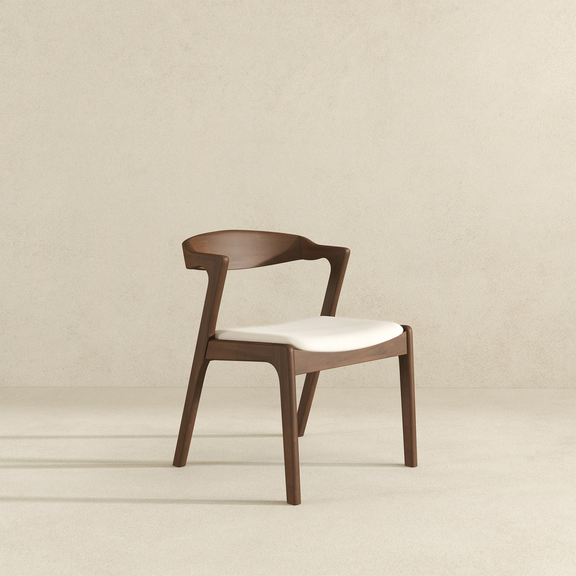 Modern wooden dining chair with white upholstered seat and curved back