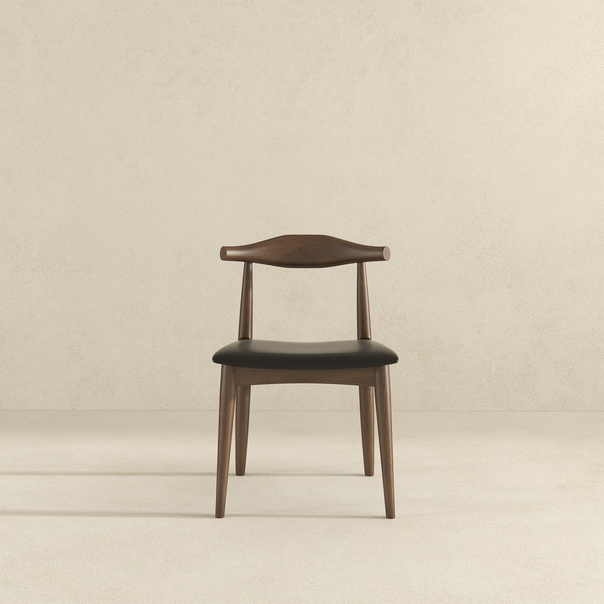 Dark wood dining chair with black upholstered seat and curved backrest