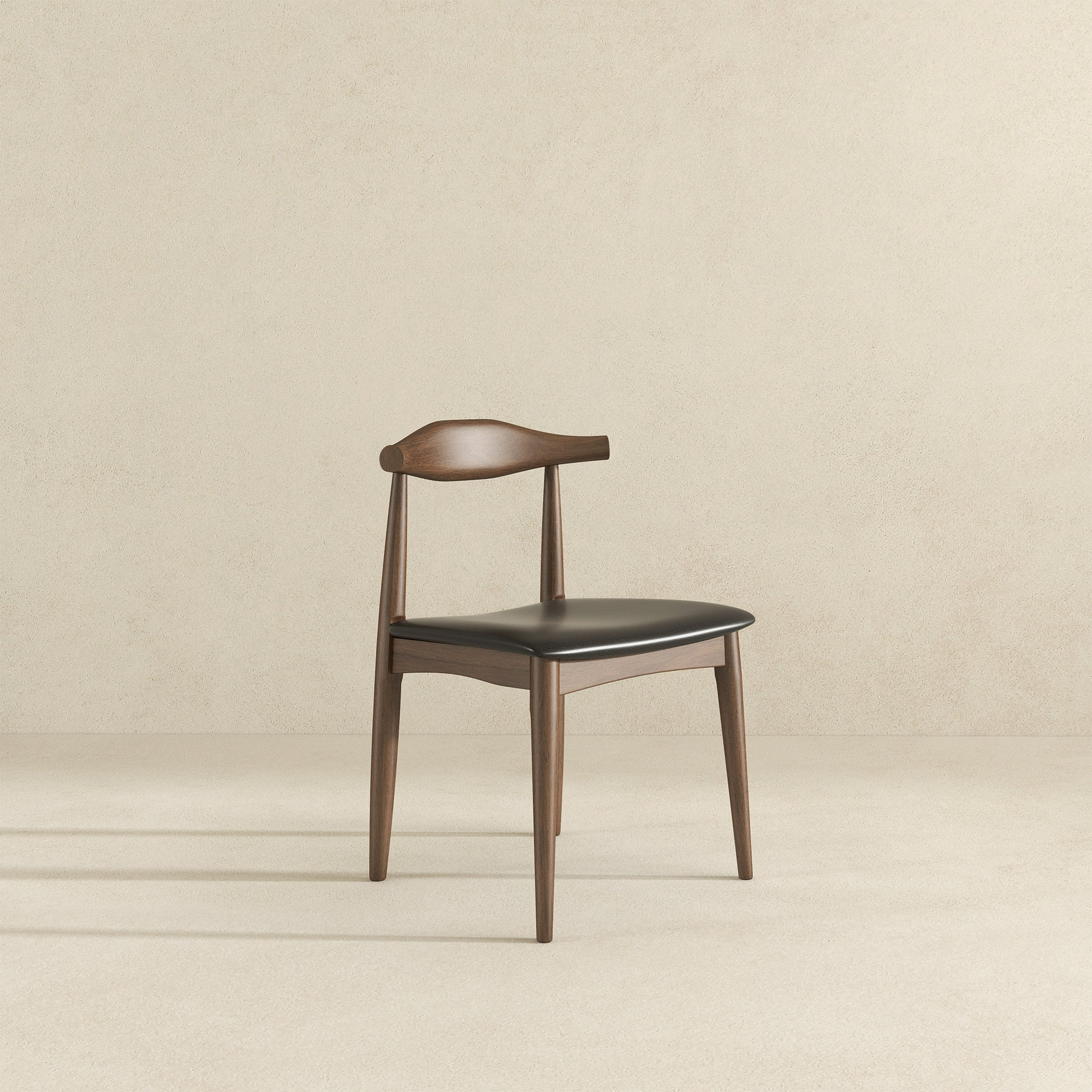 Dark wood dining chair with a black leather seat and curved backrest